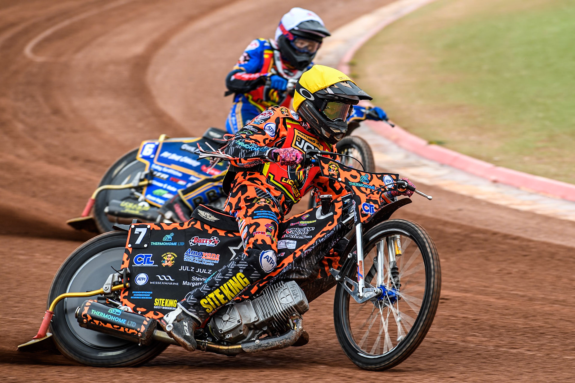 Leicester Lion Cubs' Cooper Rushen in Yellow leading team mate Ryan Ingram in White during the WSRA National Development League match between Belle Vue Colts and Leicester Lion Cubs at the National Speedway Stadium, Manchester on Friday 18th April 2025. (Photo: Ian Charles | MI News)
