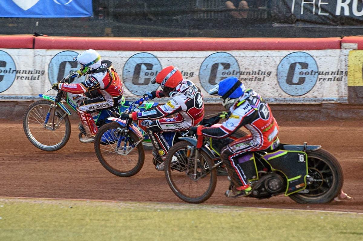 MANCHESTER, UK. AUG 9TH Tom Brennan  (Blue) and Brady Kurtz  (Red) chase Hans Andersen (White)  during the SGB Premiership match between Belle Vue Aces and Peterborough at the National Speedway Stadium, Manchester on Monday 9th August 2021. (Credit: Ian Charles | MI News)