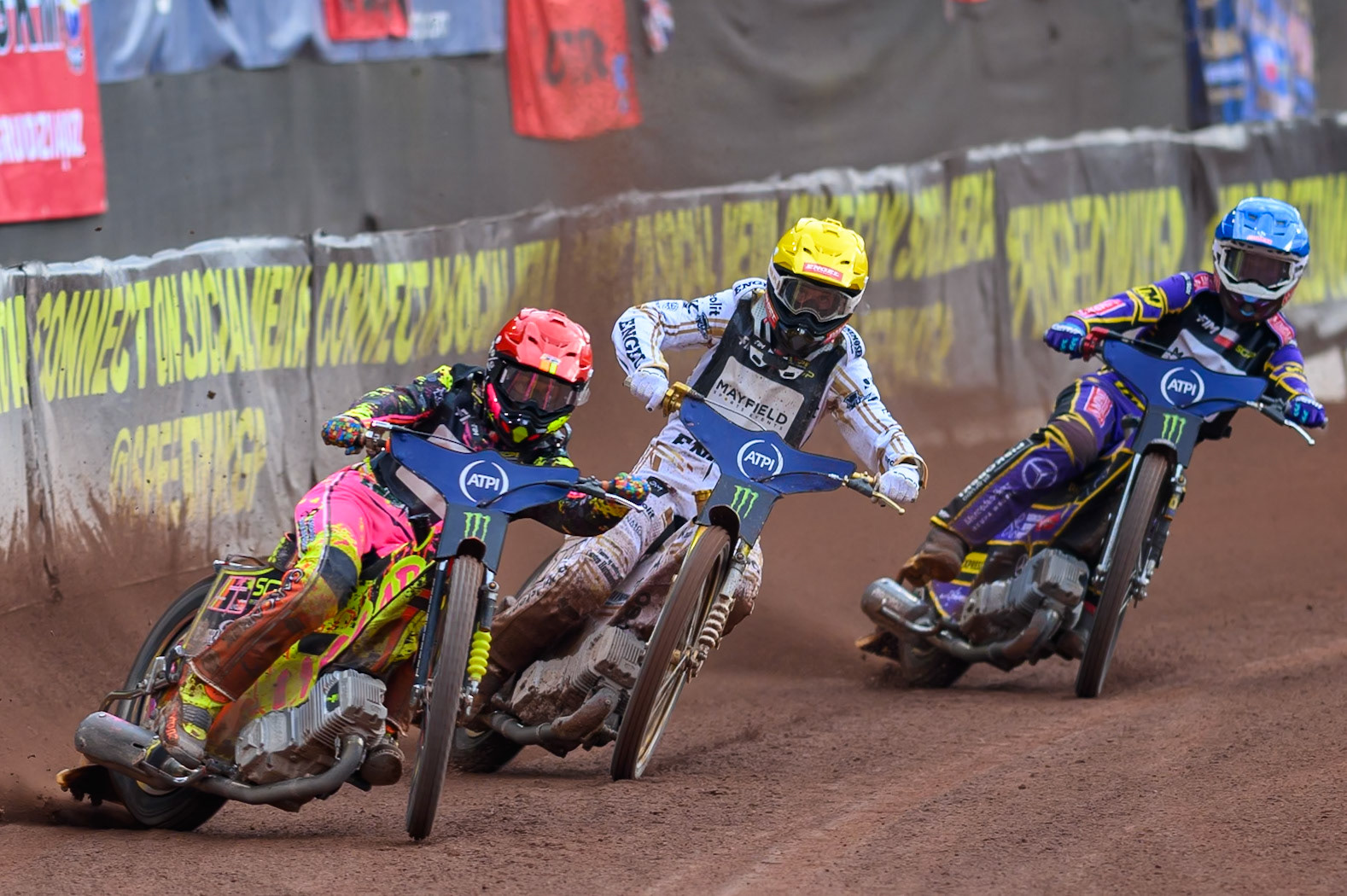 Michael Jepsen Jensen (52) of Denmark in Red leading Anders Thomsen (105) of Denmark in Yellow and Kacper Woryna (223) of Poland in Blue during the ATPI  FIM Speedway GP of Manchester at the National Speedway Stadium, Manchester on Saturday 6th June 2026. (Photo: Ian Charles | MI News)
