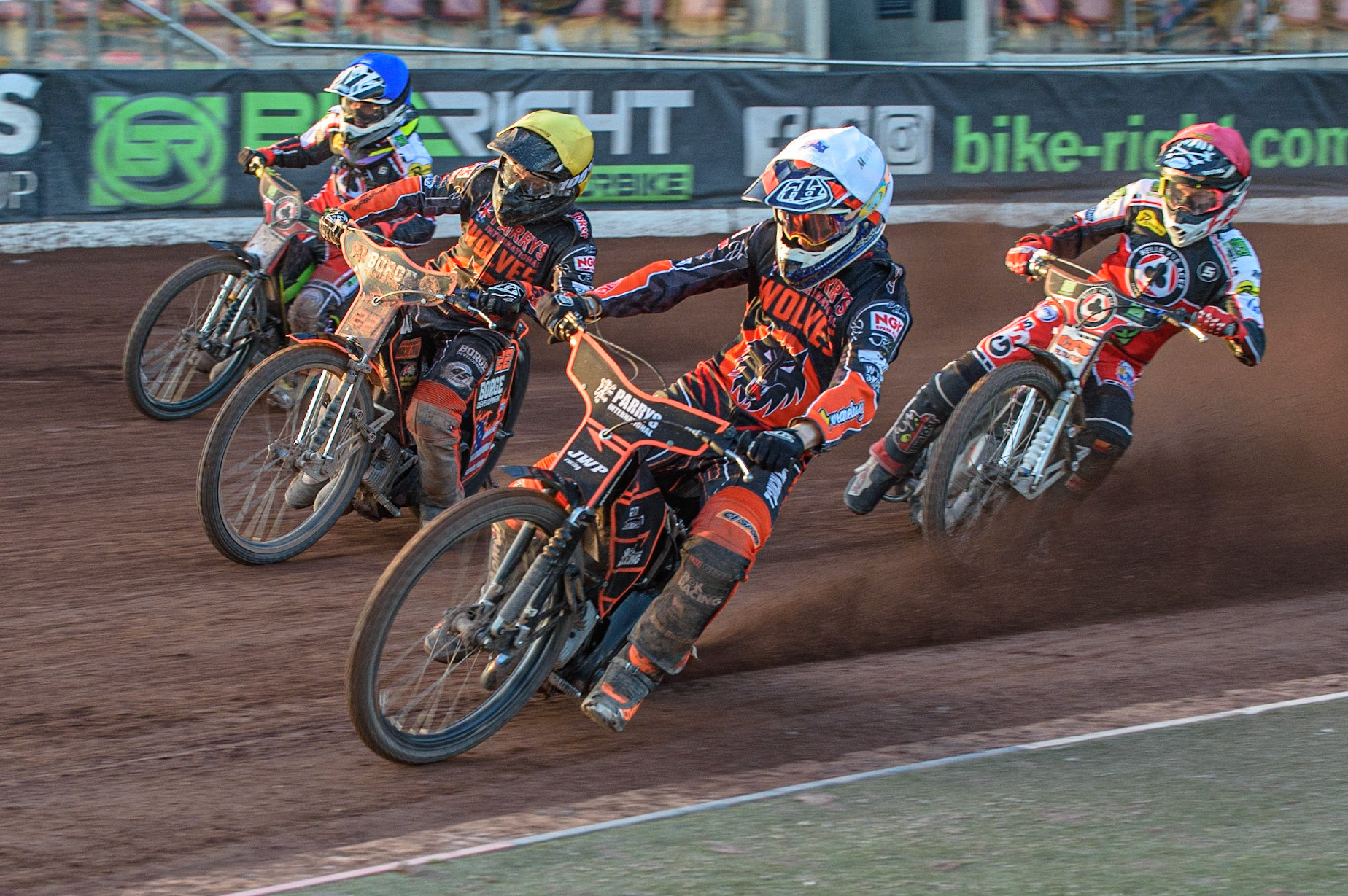 MANCHESTER, UK. JULY 15TH   Sam Masters  (White) and Luke Becker  (Yellow) lead Dan Bewley  (Red) and Tom Brennan  (Blue) into the first turn during the SGB Premiership match between Belle Vue Aces and Wolverhampton Wolves at the National Speedway Stadium, Manchester on Thursday 15th July 2021. (Credit: Ian Charles | MI News)