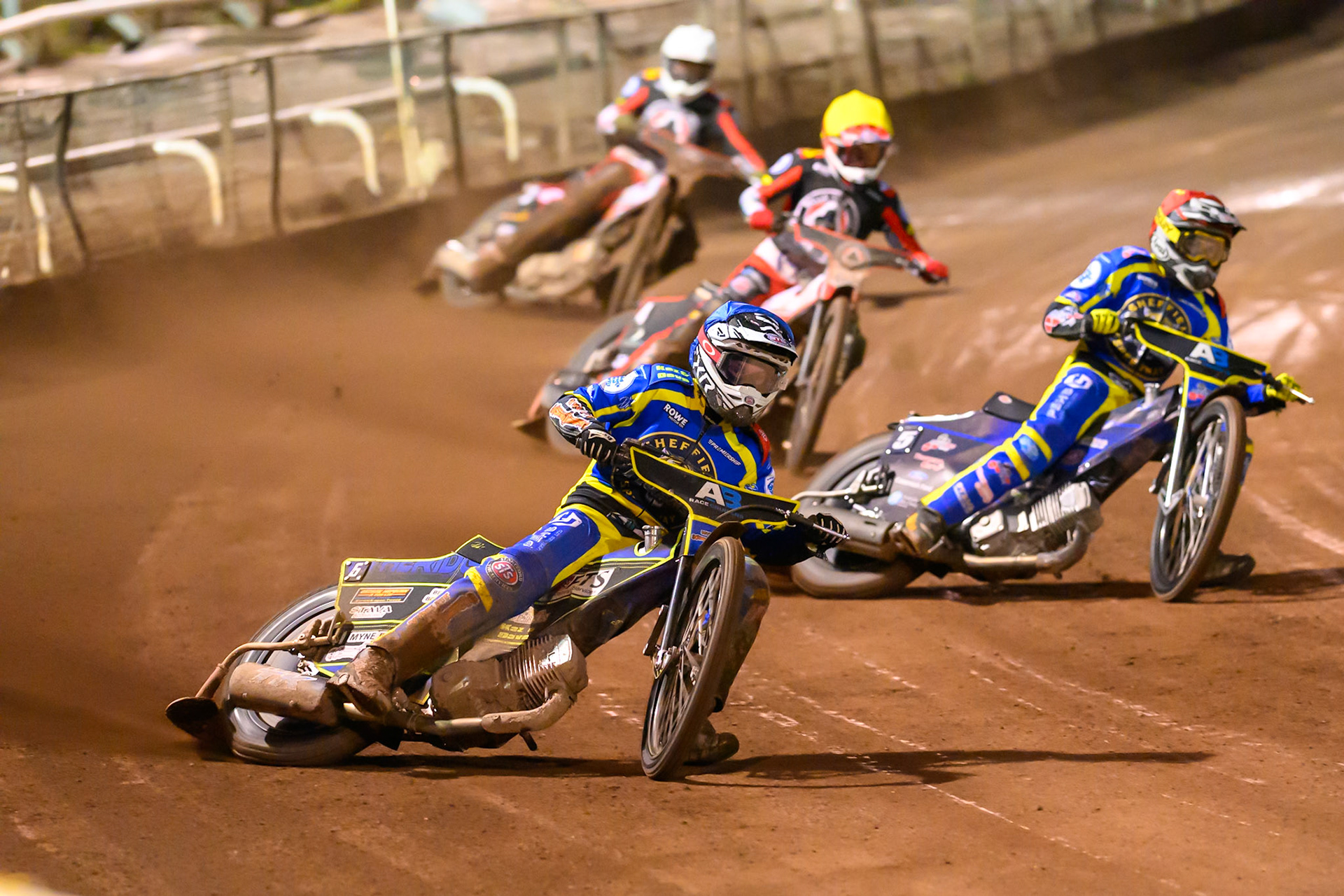 Jye Etheridge of Sheffield Tigers  in Blue leading Josh Pickering of Sheffield Tigers  in Red, Zach Cook of Belle Vue Aces in Yellow and Peter Kildemand of Belle Vue Aces in White during the Knockout Cup Northern Section match between Sheffield Tigers and Belle Vue Aces at Owlerton Stadium, Sheffield on Thursday 2nd April 2026. (Photo: Ian Charles | MI News)