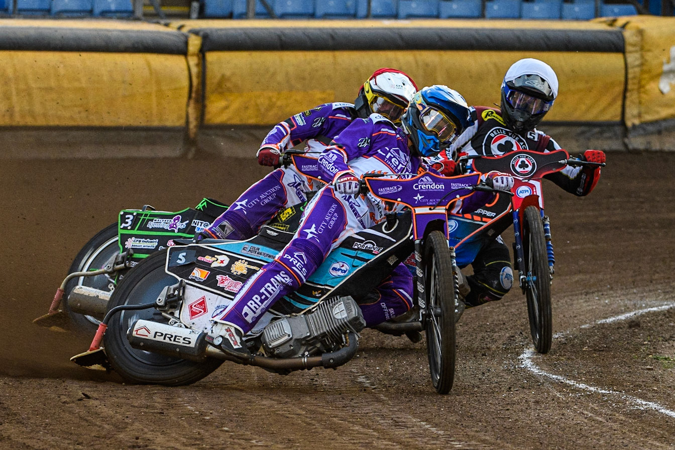 Vadim Tarasenko (Yellow) leads Brady Kurtz (White) and Benjamin Basso (Red) during the Sports Insure Premiership match between Peterborough and Belle Vue Aces at East of England Showground, Peterborough on Monday 26th June 2023. (Photo: Ian Charles | MI News)