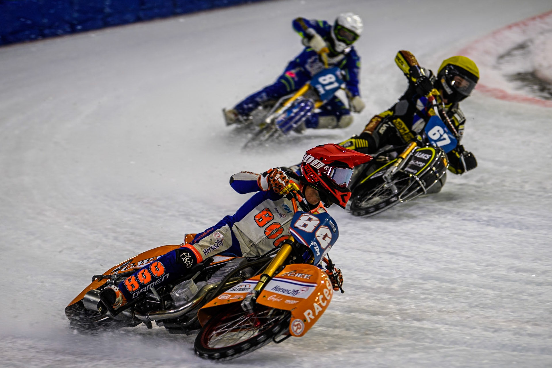 Jasper Iwema (800) of The Netherlands in Red rides outside \Heikki Huusko (67) of Finland in Yellow and Maximilian Niedermaier (38) of Germany in White during the FIM Ice Speedway Gladiators World Championship, Final 4 at the Ice Stadium, Thialf, Heerenveen on Sunday 6th April 2025. (Photo: Ian Charles | MI News)