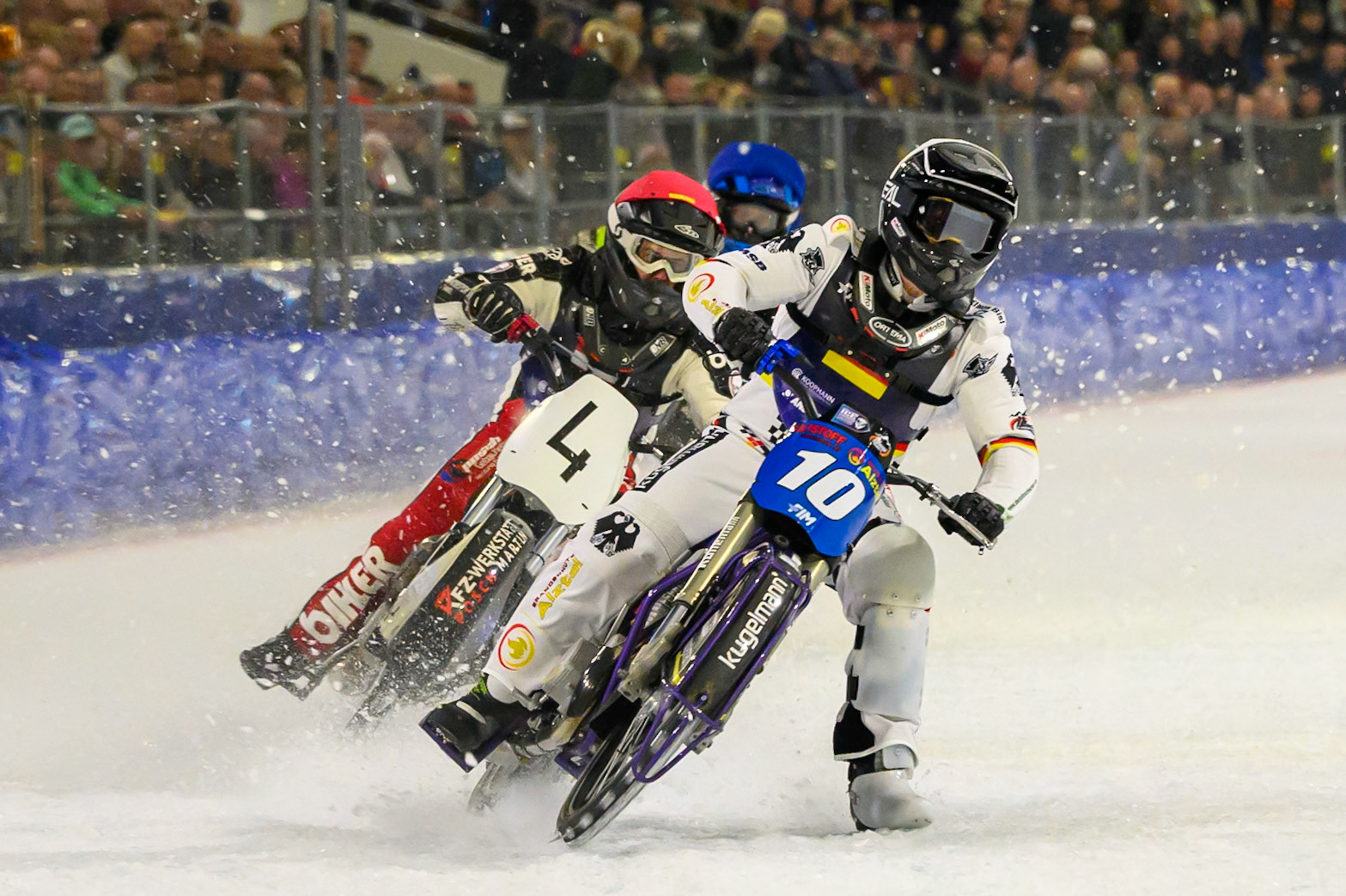 Austria v Germany: Christoph Kirchner (10) of Germany leading Martin Posch (4) of Austria  in Red and Harald Simon (3) of Austria   in Blue during the FIM Ice Speedway Of Nations at Ice Rink Thialf, Heerenveen on Sunday 12th April 2026. (Photo: Ian Charles | MI News)