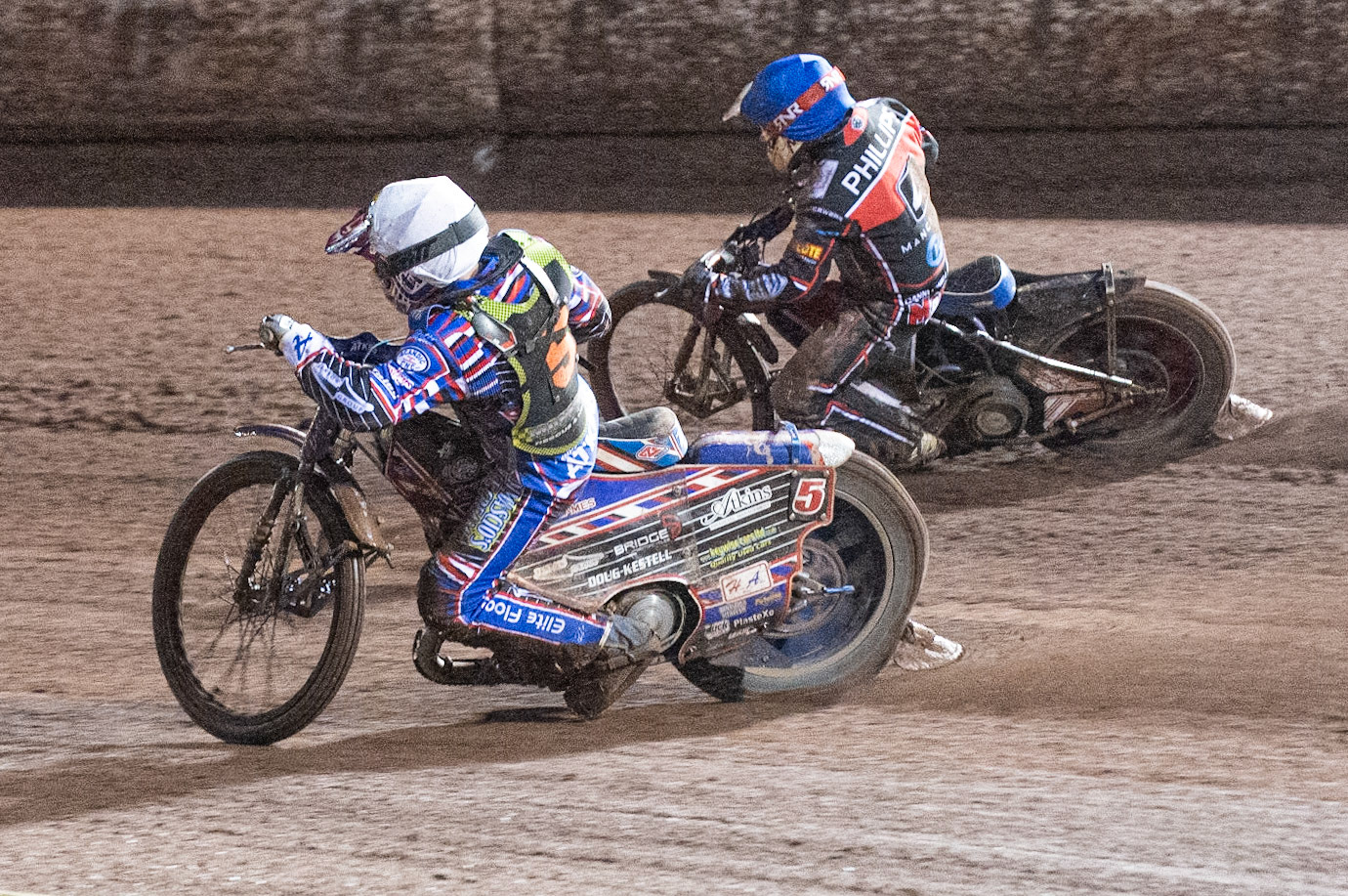 Photo: Ian Charles

Henry Atkins  (White) passes Danny Phillips  (Blue) on the inside 

Belle Vue Colts v Mildenhall Fen Tigers, National League, Belle Vue National Speedway Stadium, Manchester, Monday 2  September  2019
