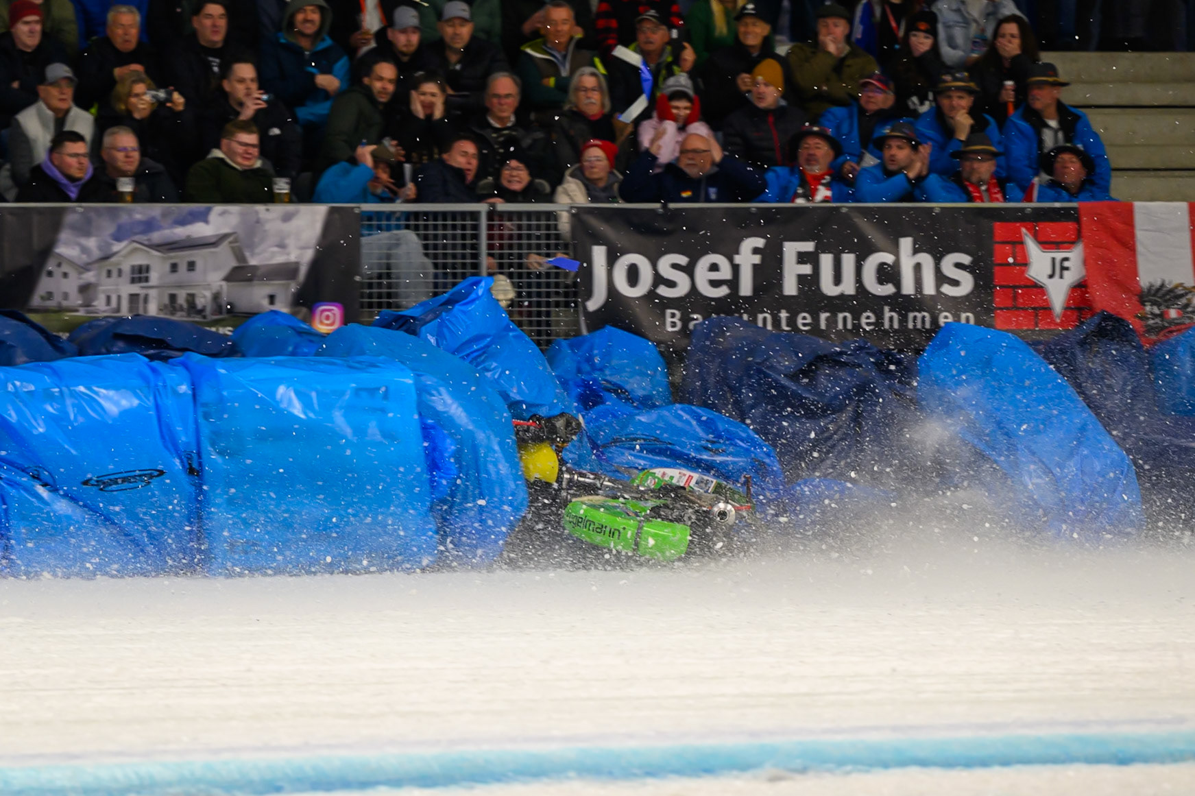 Johann Weber (33) of Germany  spins off behind Heikki Huusko (67) of Finland in Blue during the Ice Speedway Gladiators World Championship Final 1 at Max-Aicher-Arena, Inzell on Saturday 14th March 2026. (Photo: Ian Charles | MI News)