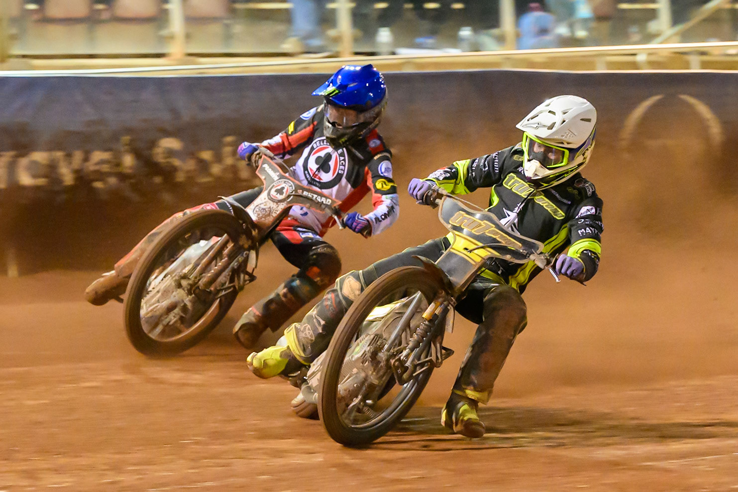 Tom Brennan of Ipswich Witches  in White rides inside Dan Bewley of Belle Vue Aces in Blue during the Rowe Motor Oil Premiership match between Belle Vue Aces and Ipswich Witches at the National Speedway Stadium, Manchester on Monday 20th April 2026. (Photo: Ian Charles | MI News)