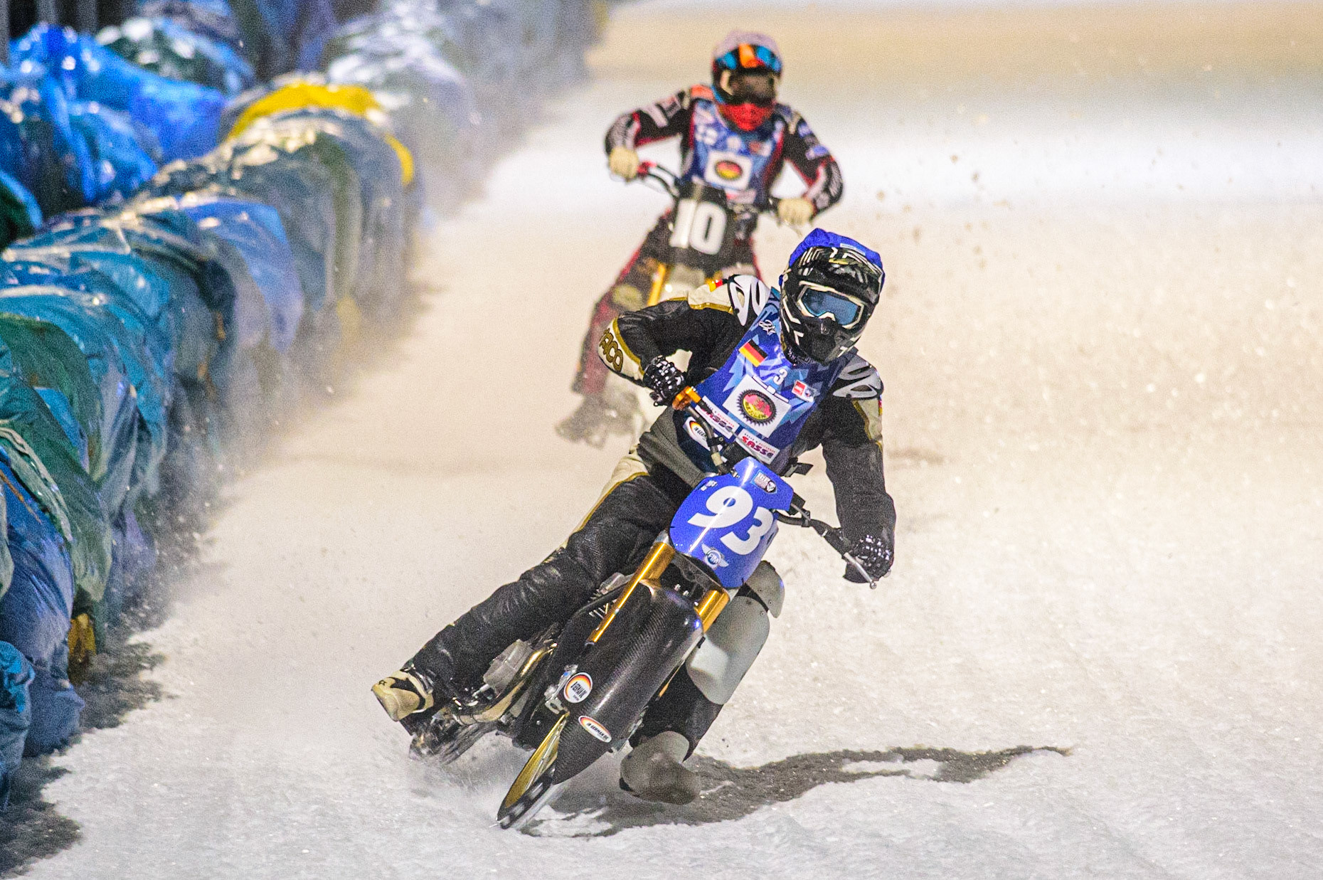 Franz Mayerbüchler (Blue) leads Topi Mustonen (White) during the German Individual Ice Speedway Championship at Horst-Dohm-Eisstadion, Berlin on Friday 3rd March 2023. (Photo: Ian Charles | MI News)