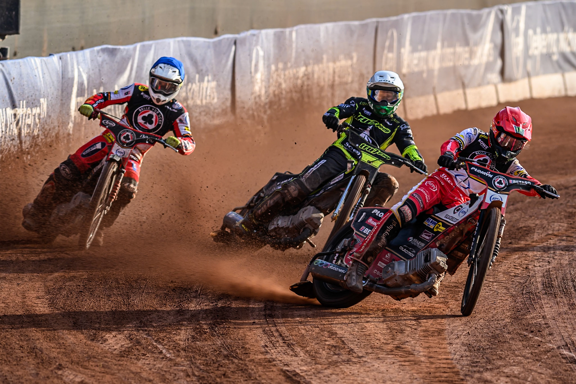 Belle Vue Aces' Dan Bewley  in Red leading Belle Vue Aces' Jake Mulford  in Blue and Ipswich Witches' Jason Doyle  in White during the Rowe Motor Oil Premiership match between Belle Vue Aces and Ipswich Witches at the National Speedway Stadium, Manchester on Monday 30th June 2025. (Photo: Ian Charles | MI News)