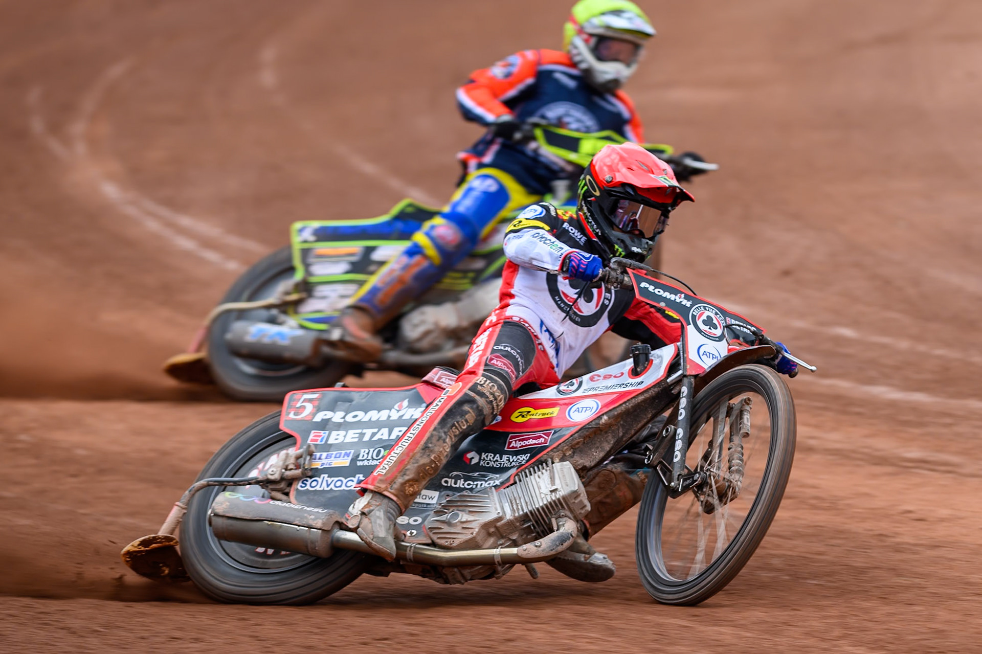 Dan Bewley of Belle Vue Aces in Red leading Jye Etheridge, Guest Rider for Northampton Foxes in Yellow during the Rowe Motor Oil Premiership match between Belle Vue Aces and Northampton Foxes at the National Speedway Stadium, Manchester on Monday 4th May 2026. (Photo: Ian Charles | MI News)