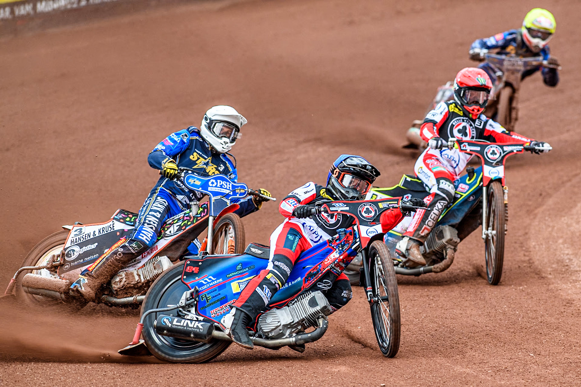 Belle Vue Aces' Ben Cook in Blue and Belle Vue Aces' Jaimon Lidsey in Red leading King Lynn Stars' Niels-Kristian Iversen in White and King Lynn Stars' Michael Palm Toft in Yellow during the Rowe Motor Oil Premiership match between Belle Vue Aces and King's Lynn Stars at the National Speedway Stadium, Manchester on Monday 20th May 2024. (Photo: Ian Charles | MI News)