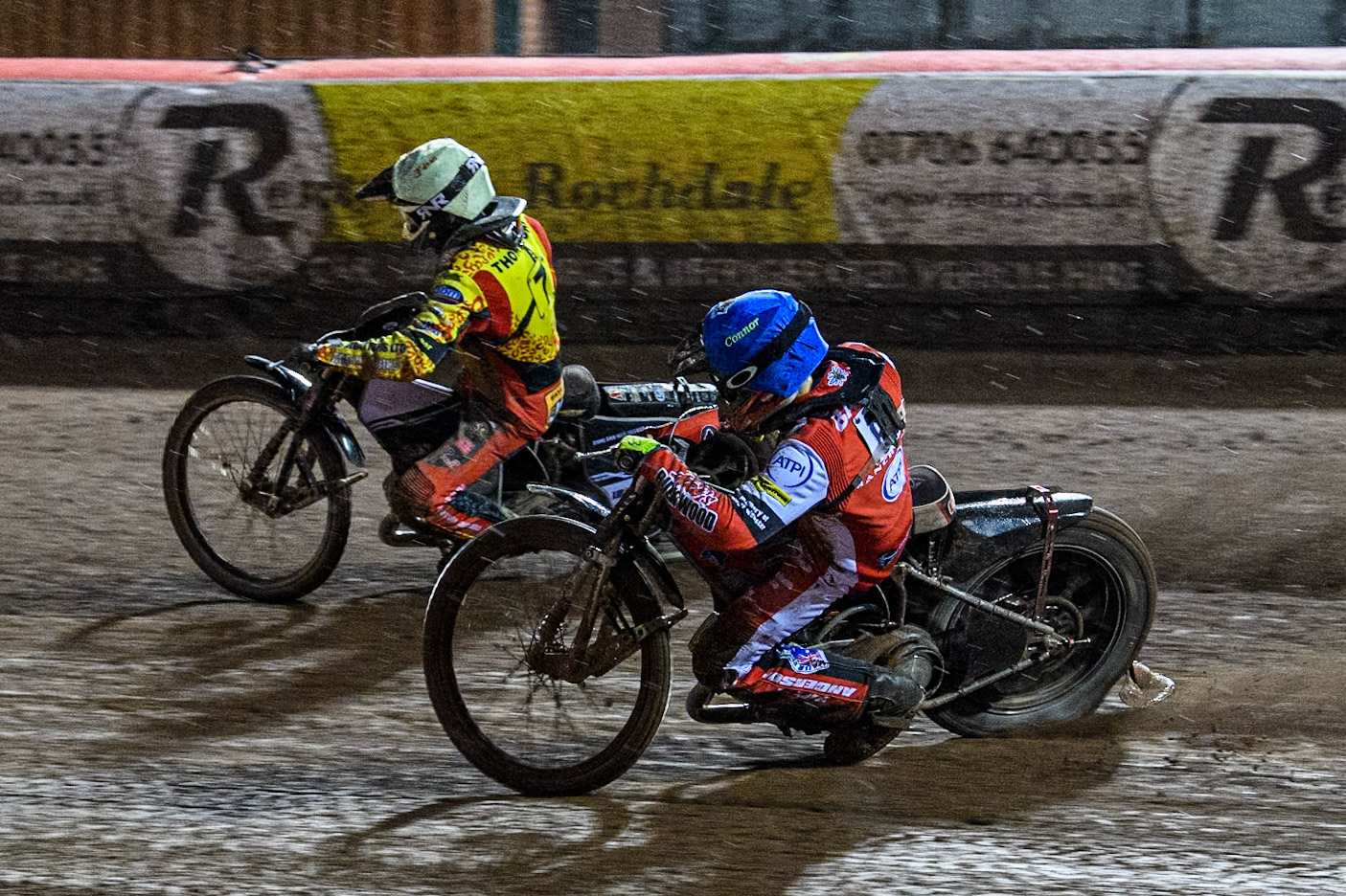 Connor Bailey of Belle Vue Aces in Blue chases \l;ly\ in Yellow during the Rowe Motor Oil Premiership match between Belle Vue Aces and Leicester Lions at the National Speedway Stadium, Manchester on Saturday 6th April 2024. (Photo: Ian Charles | MI News)