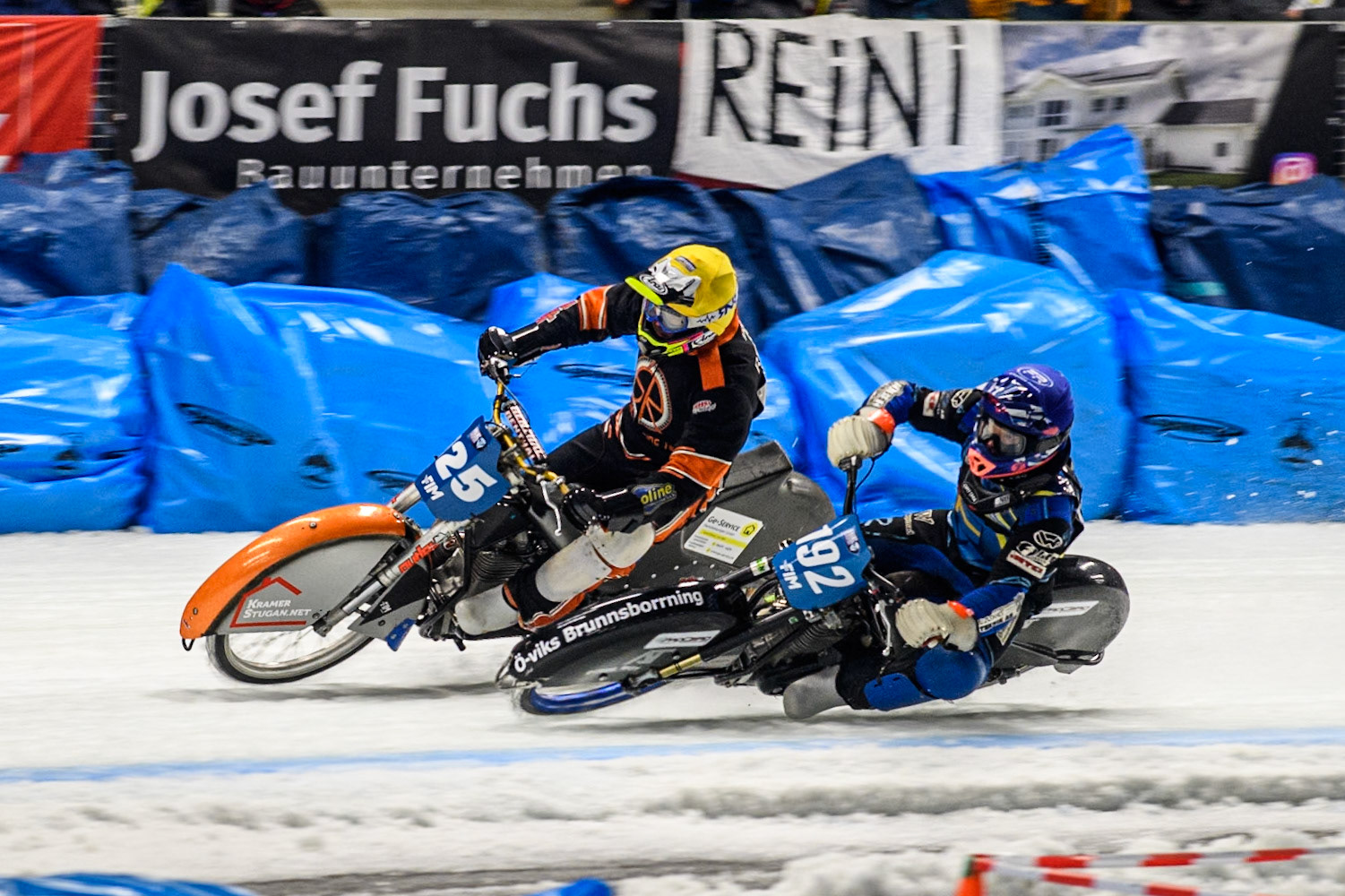Niclas Svensson (192) of Sweden in Blue rides inside Sebastian Reitsma (125) of The Netherlands in Yellow during the Ice Speedway Gladiators World Championship Final 1 at Max-Aicher-Arena, Inzell on Saturday 15th March 2025. (Photo: Ian Charles | MI News)