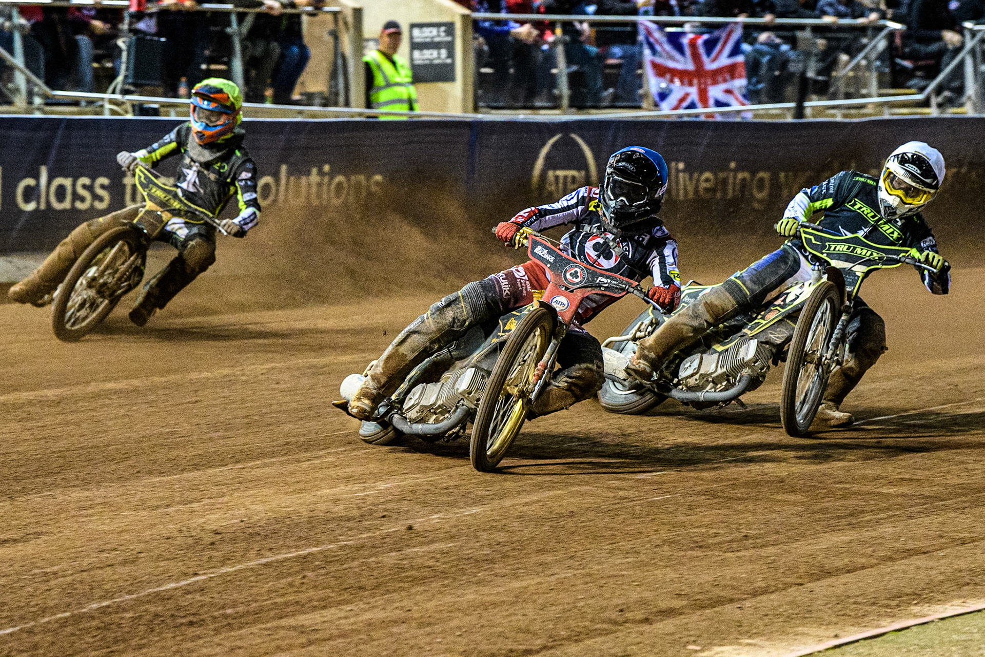 Norick Blodorn (Blue) leads  Danyon Hume (White) and Keynan Rew (Yellow) during the Sports Insure Premiership Semi Final Playoff 2nd leg match between Belle Vue Aces and Ipswich Witches at the National Speedway Stadium, Manchester on Monday 25th September 2023. (Photo: Ian Charles | MI News)