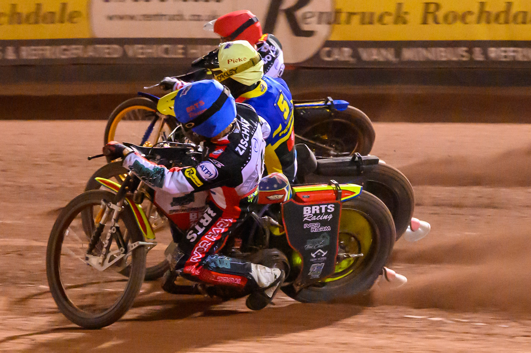 Tate Zischke of Belle Vue Aces in Blue on the inside of Josh Pickering of Sheffield Tigers in Yellow  and Jason Doyle of Belle Vue Aces in Red during the Rowe Motor Oil Premiership match between Belle Vue Aces and Sheffield Tigers at the National Speedway Stadium, Manchester on Monday 14th September 2026. (Photo: Ian Charles | MI News)