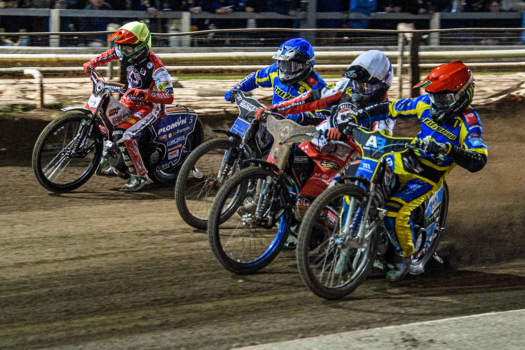 Sheffield Tigers' Jack Holder  in Red rides inside Belle Vue Aces' Brady Kurtz  in White, Sheffield Tigers' Guest Rider Chris Harris  in Blue and Belle Vue Aces' Dan Bewley  in Yellow during the Rowe Motor Oil Premiership Play Off Semi Final 2nd leg between Sheffield Tigers and Belle Vue Aces at Owlerton Stadium, Sheffield on Thursday 19th September 2024. (Photo: Ian Charles | MI News)