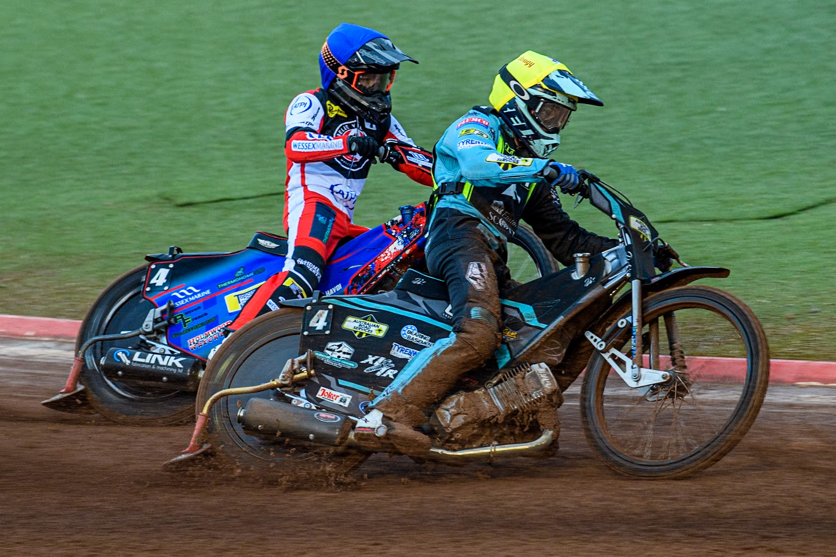 Ipswich Witches' Guest Ryan Douglas in Yellow passes Belle Vue Aces' Ben Cook in Blue during the Rowe Motor Oil Premiership match between Belle Vue Aces and Ipswich Witches at the National Speedway Stadium, Manchester on Monday 22nd April 2024. (Photo: Ian Charles | MI News)