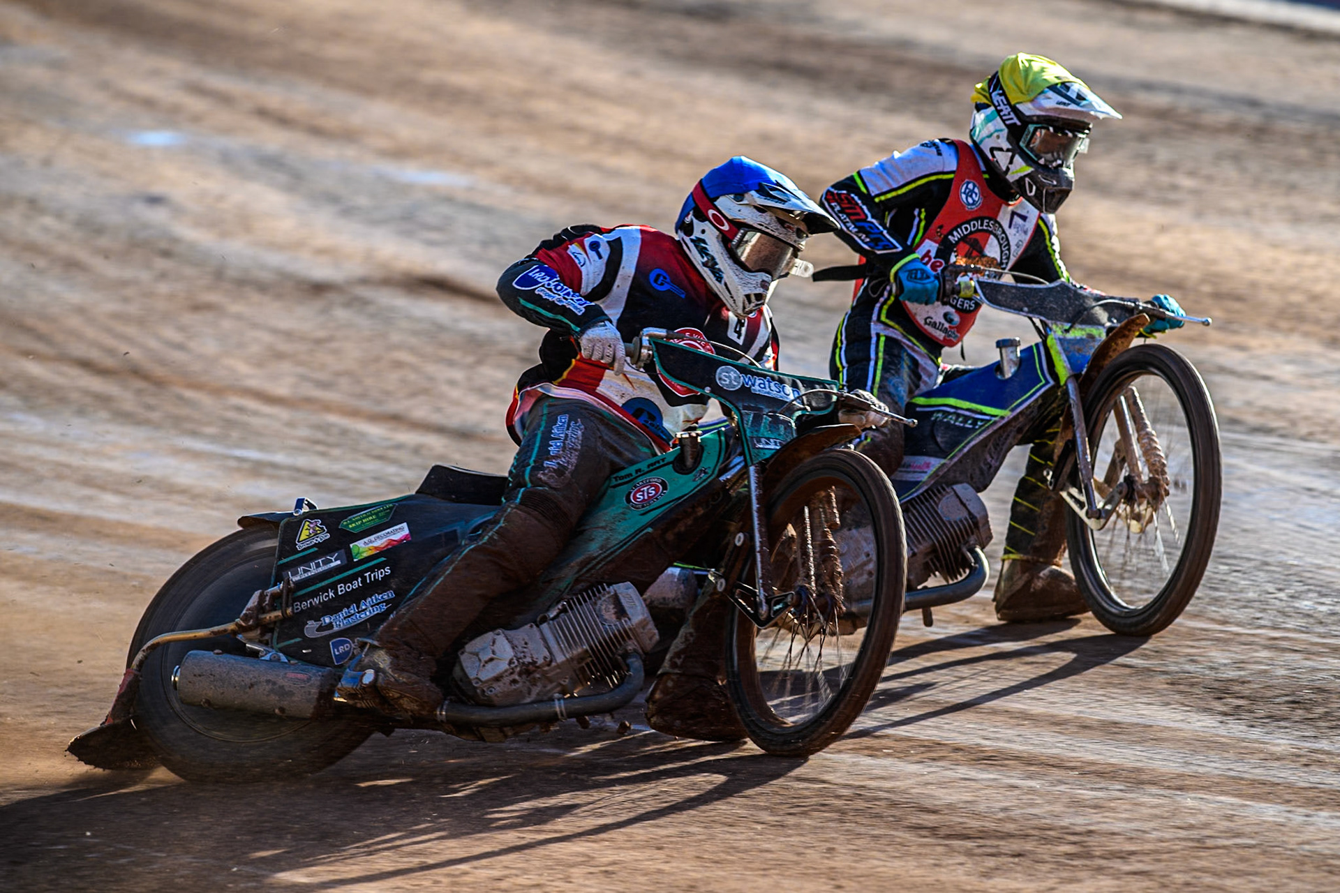 Belle Vue Colts' Guest rider Mason Watson in Blue rides outside Middlesbrough Tigers' Ben Rathbone in Yellow during the WSRA National Development League match between Belle Vue Colts and Middlesbrough Tigers at the National Speedway Stadium, Manchester on Monday 17th June 2024. (Photo: Ian Charles | MI News)