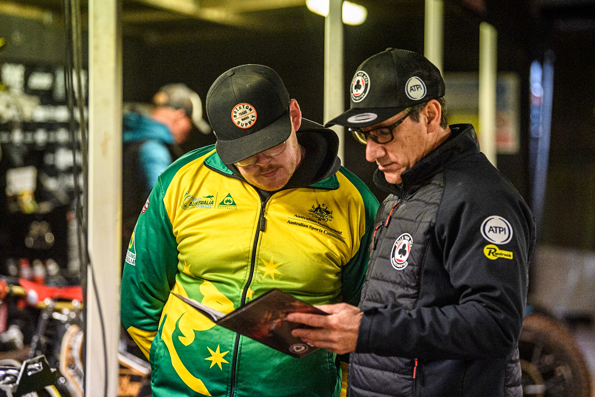 Belle Vue Aces' Team Manager Mark Lemon (Right) chats with Brady Kurtz mechanic during the Rowe Motor Oil Premiership Grand Final 2nd Leg between Leicester Lions and Belle Vue Aces at the Pidcock Motorcycles Arena, Leicester on Thursday 26th September 2024. (Photo: Ian Charles | MI News)
