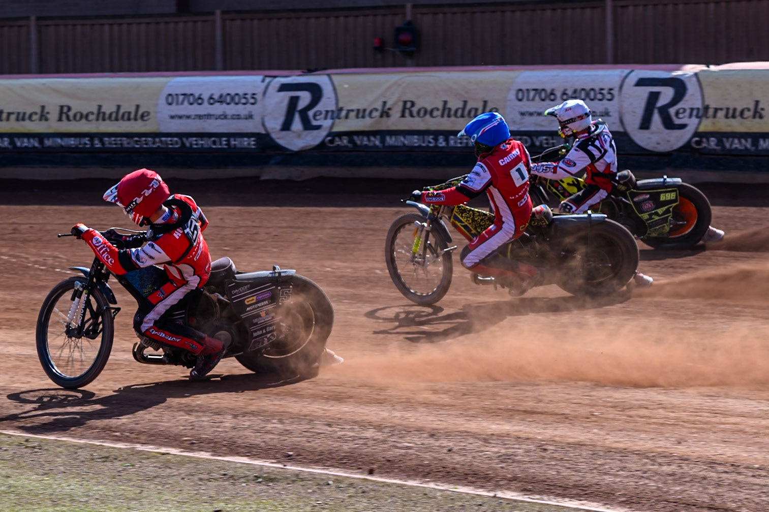 Freddy Hodder of Belle Vue Colts in Red on the inside of William Cairns of Belle Vue Colts  in Blue and Ace Pijper of Middlesborough Tigers  in White during the WSRA National Development League match between Belle Vue Colts and Middlesbrough Tigers at the National Speedway Stadium, Manchester on Sunday 10th August 2025. (Photo: Mark Fletcher | MI News)
