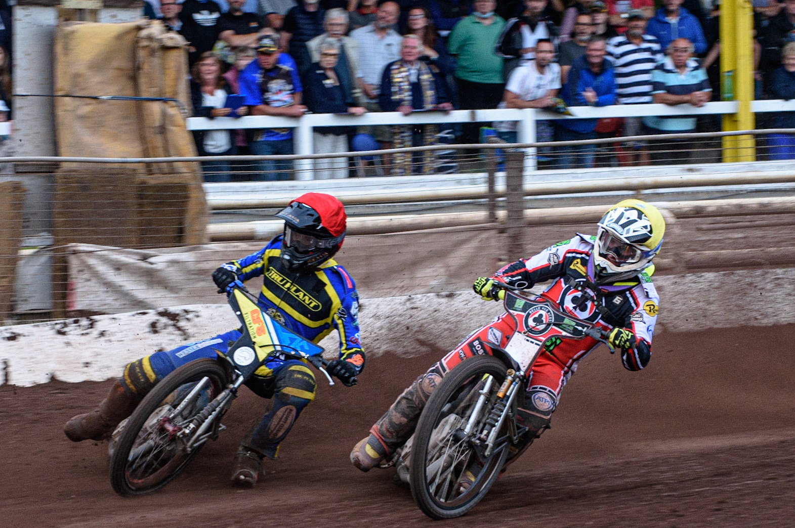 SHEFFIELD, UK. JULY 1ST     Tom Brennan  (Yellow) inside Adam Ellis  (Red) during the SGB Premiership match between Sheffield Tigers and Belle Vue Aces at Owlerton Stadium, Sheffield on Thursday 1st July 2021. (Credit: Ian Charles | MI News)