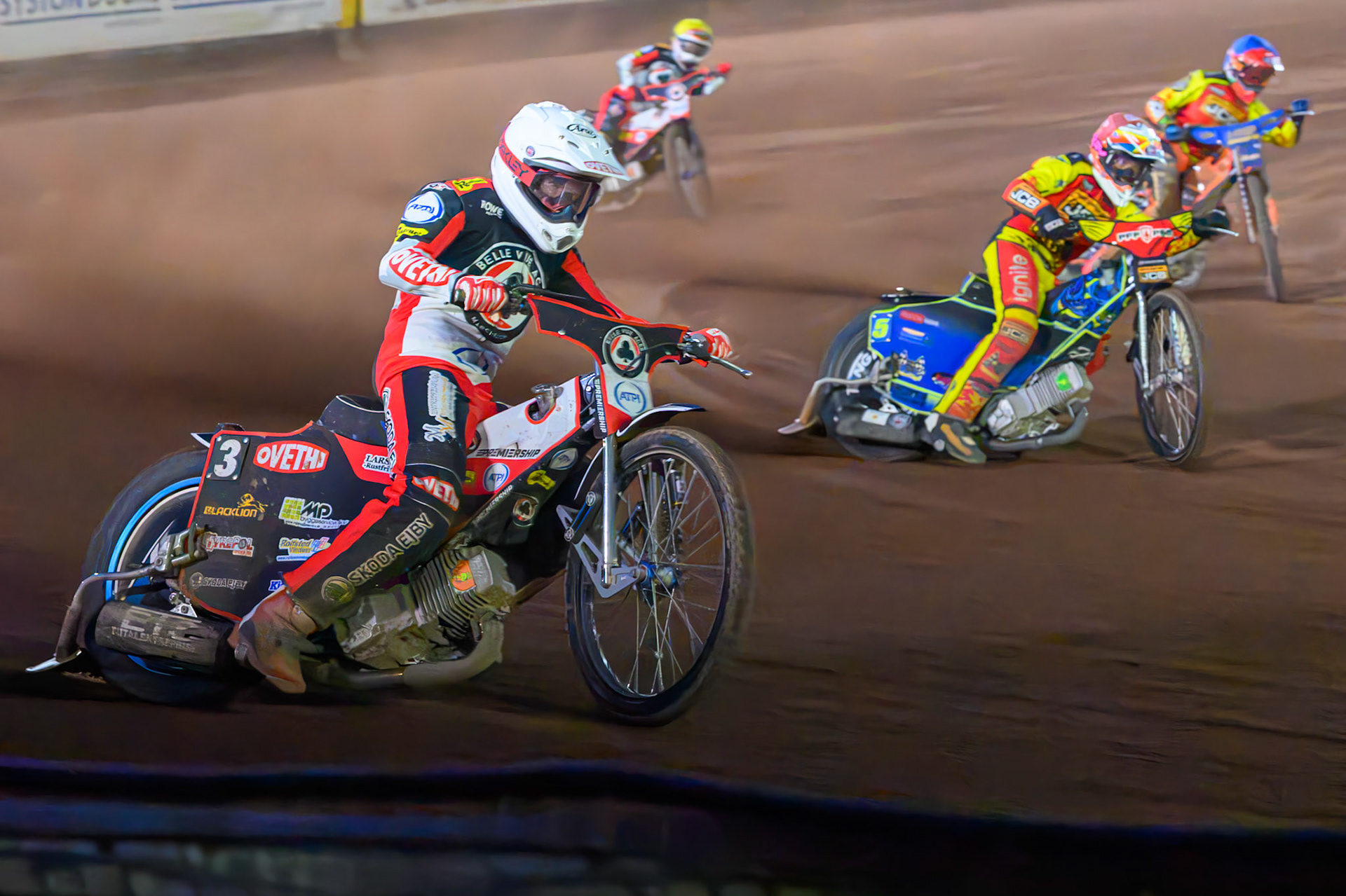 Peter Kildemand of Belle Vue Aces  in White rides outside Sam Masters of Leicester Lions in Red with Jordan Jenkins, Guest Rider for Leicester Lions  in Blue and Zach Cook of Belle Vue Aces  in Yellow behind during the Rowe Motor Oil Premiership match between Leicester Lions and Belle Vue Aces at the Hydroscan Arena, Leicester on Monday 7th September 2026. (Photo: Ian Charles | MI News)