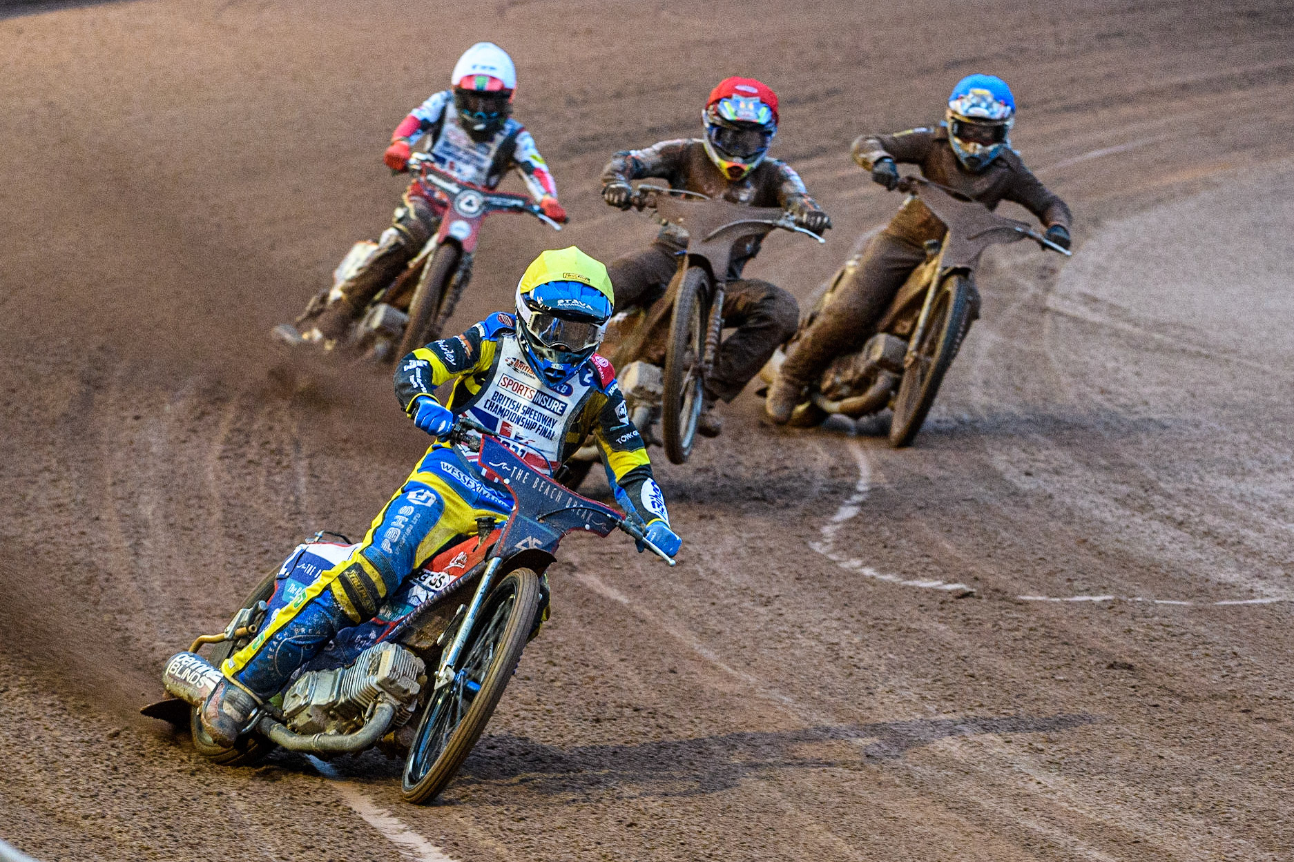 Adam Ellis (Yellow) leads the heat as Leon Flint (Red) picks up some drive with Dan Bewley (White) and Sam Hagon (Blue) behind during the Sports Insure British Speedway Final at the National Speedway Stadium, Manchester on Monday 14th August 2023. (Photo: Ian Charles | MI News)