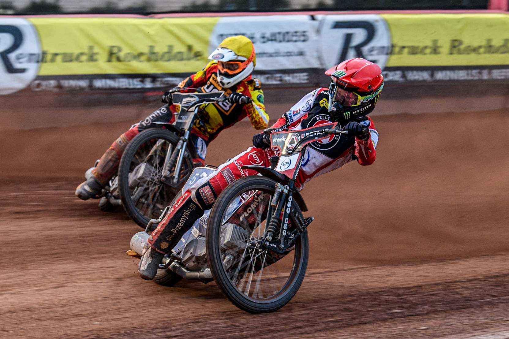Belle Vue Aces' Dan Bewley in Red rides inside Leicester Lions' Richard Lawson in Yellow during the Rowe Motor Oil Premiership match between Belle Vue Aces and Leicester Lions at the National Speedway Stadium, Manchester on Monday 24th June 2024. (Photo: Ian Charles | MI News)