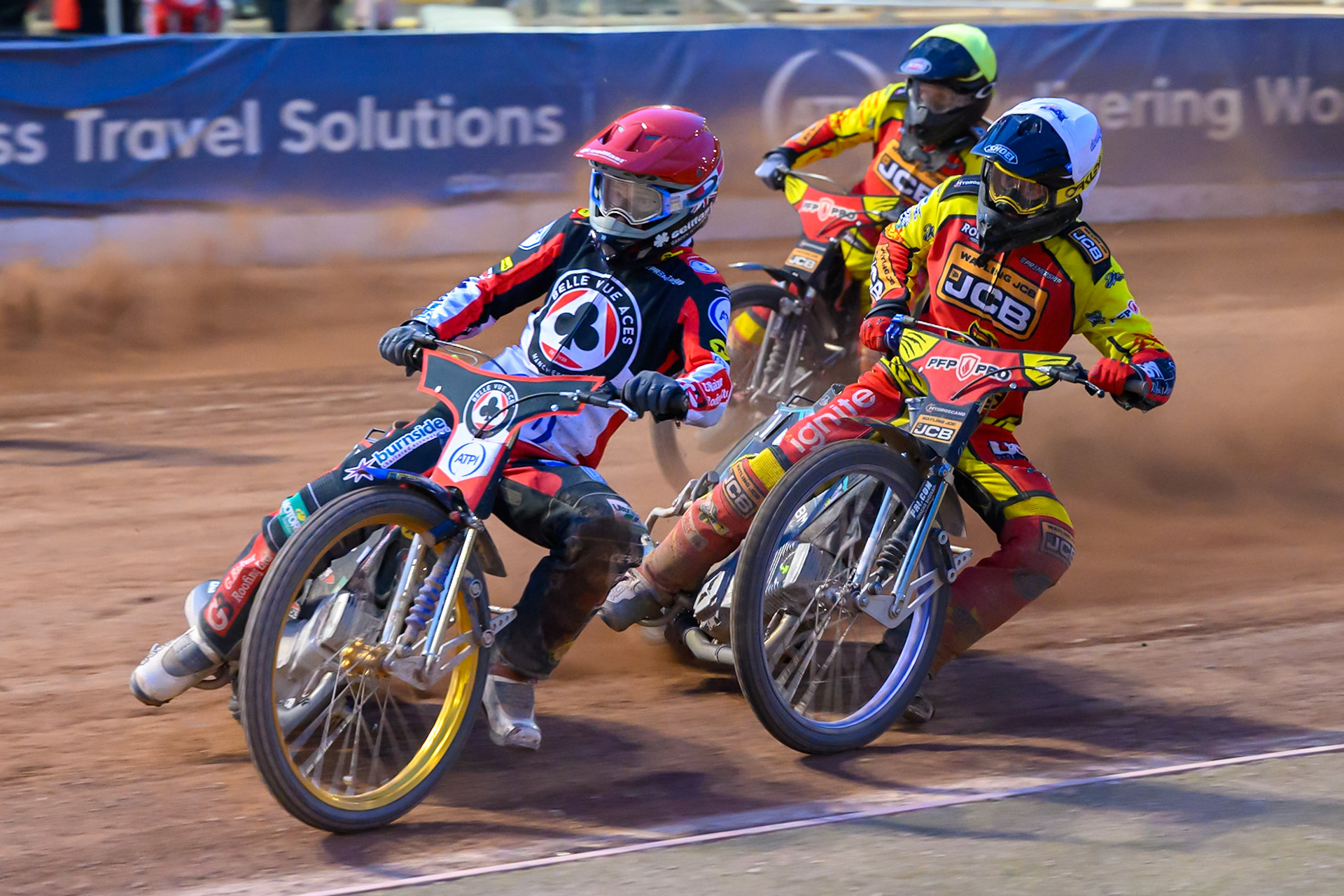 Jason Doyle of Belle Vue Aces in Red leading Ryan Douglas of Leicester Lions in White  and Dan Thompson of Leicester Lions in Yellow during the Rowe Motor Oil Premiership match between Belle Vue Aces and Leicester Lions at the National Speedway Stadium, Manchester on Monday 3rd August 2026. (Photo: Ian Charles | MI News)
