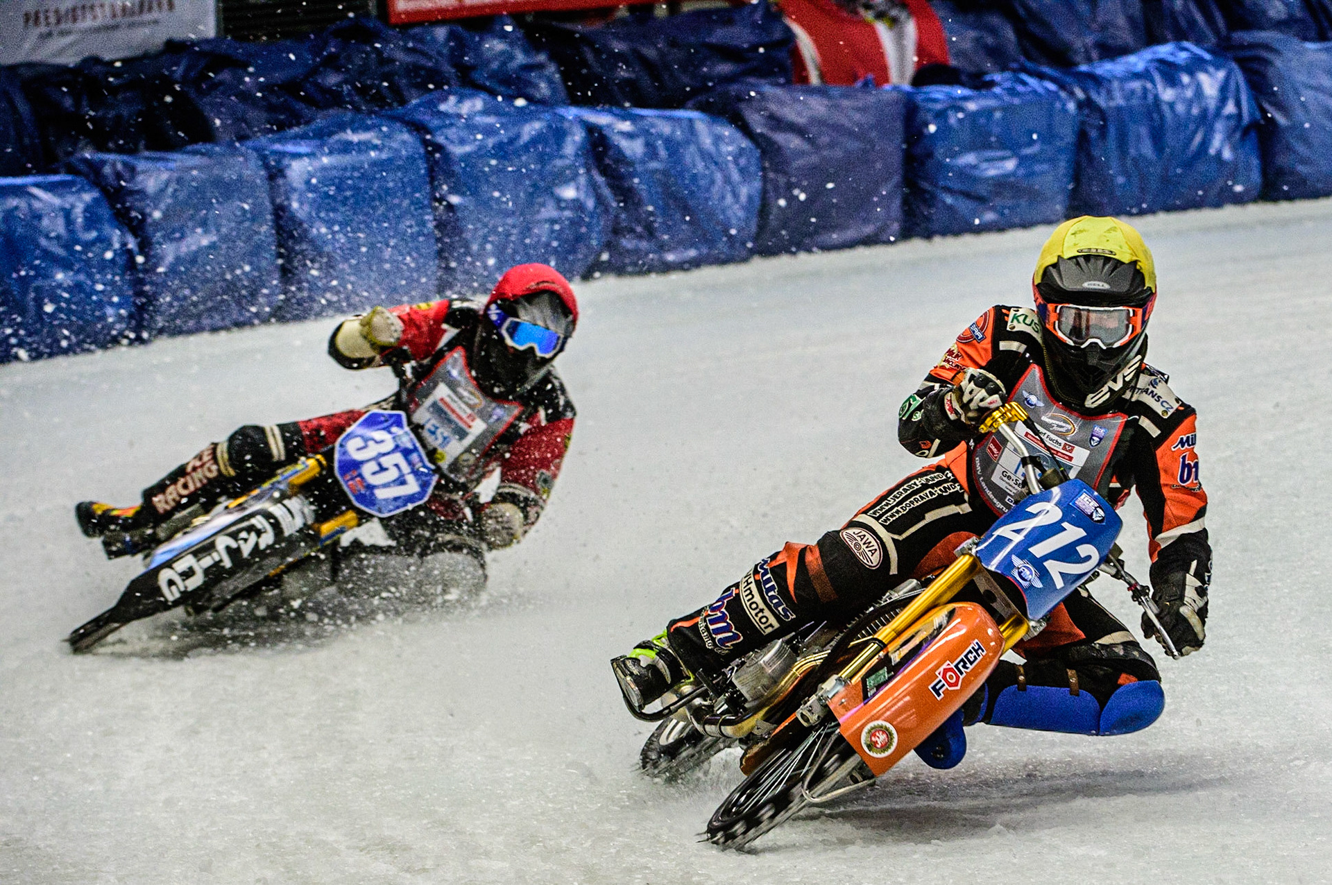 Lukas Hutla (212) (Yellow) leads Jo Saetre (357)(Red) during the Ice Speedway Gladiators World Championship Final 1 at Max-Aicher-Arena, Inzell, Germany on Saturday 18th March 2023. (Photo: Ian Charles | MI News)