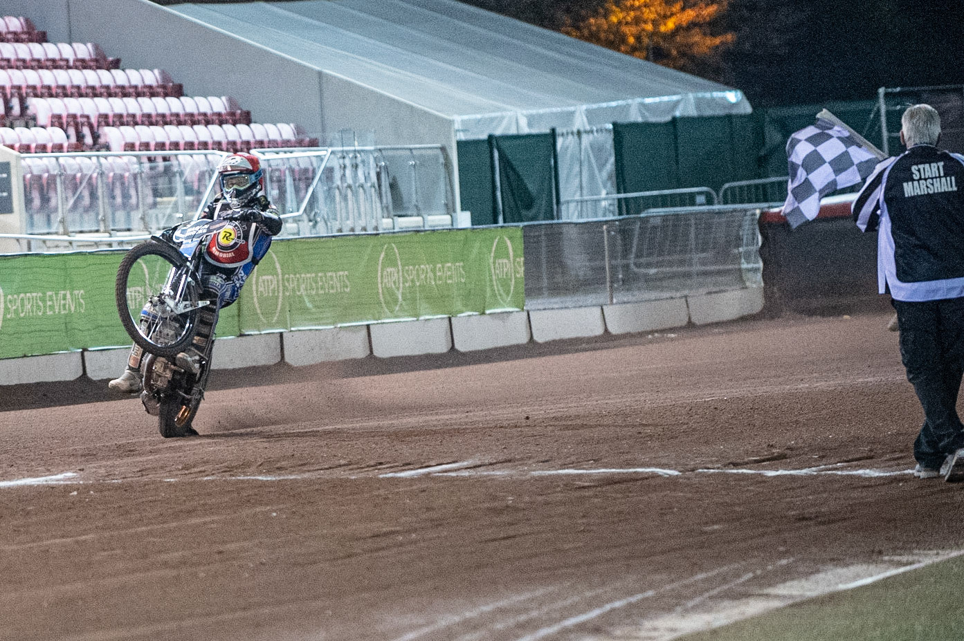 Photo: Ian CharlesJason Doyle wheelies over the finish line to win the finalPeter Craven Memorial Trophy, National Speedway Stadium, Manchester Thursday  22  October  2020