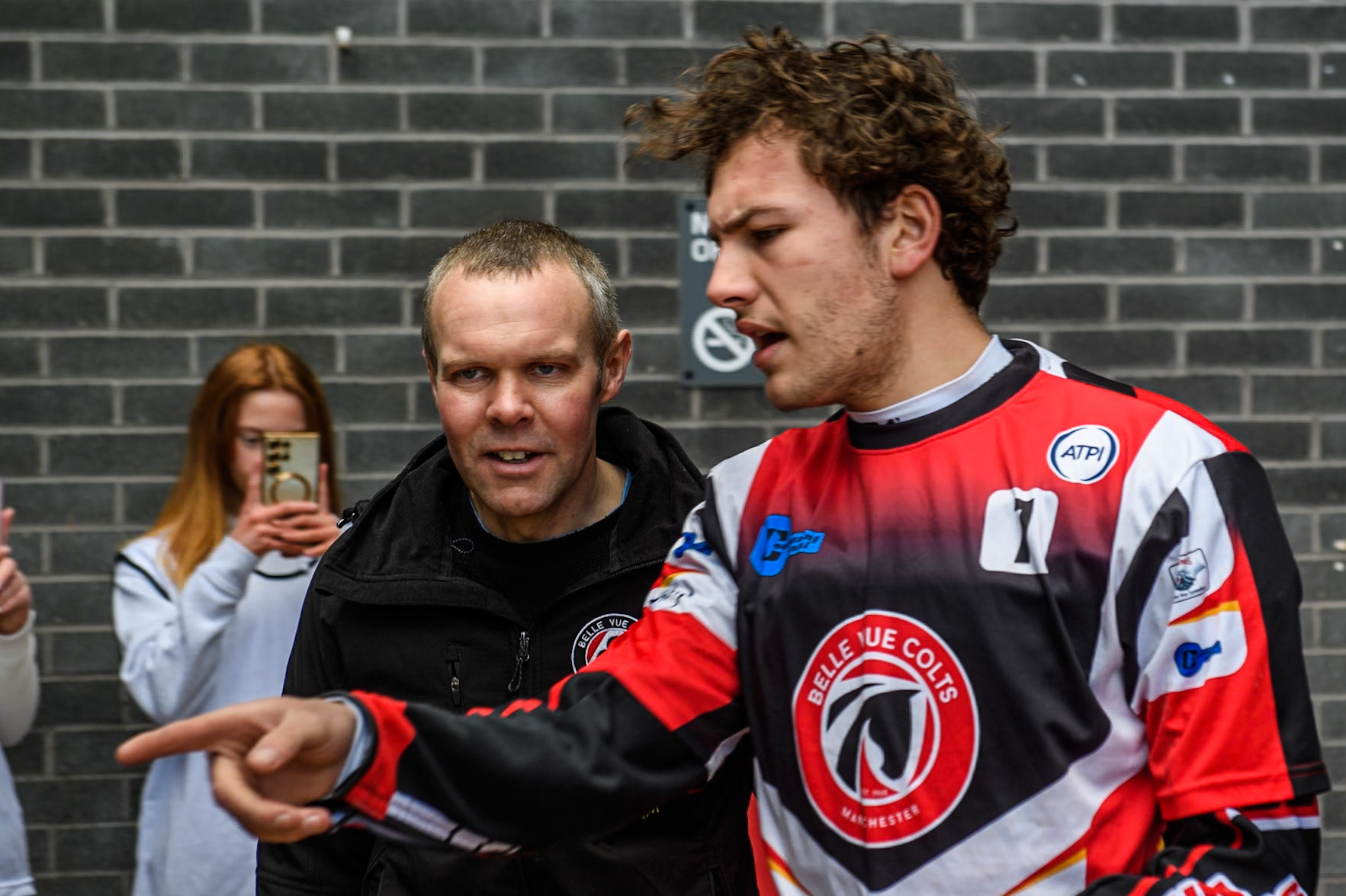 Belle Vue Colts' Harry McGurk (Red) with his mechanic Andy Mellish during the WSRA  National Development League match between Belle Vue Colts and Leicester Lion Cubs at the National Speedway Stadium, Manchester on Friday 29th March 2024. (Photo: Ian Charles | MI News)