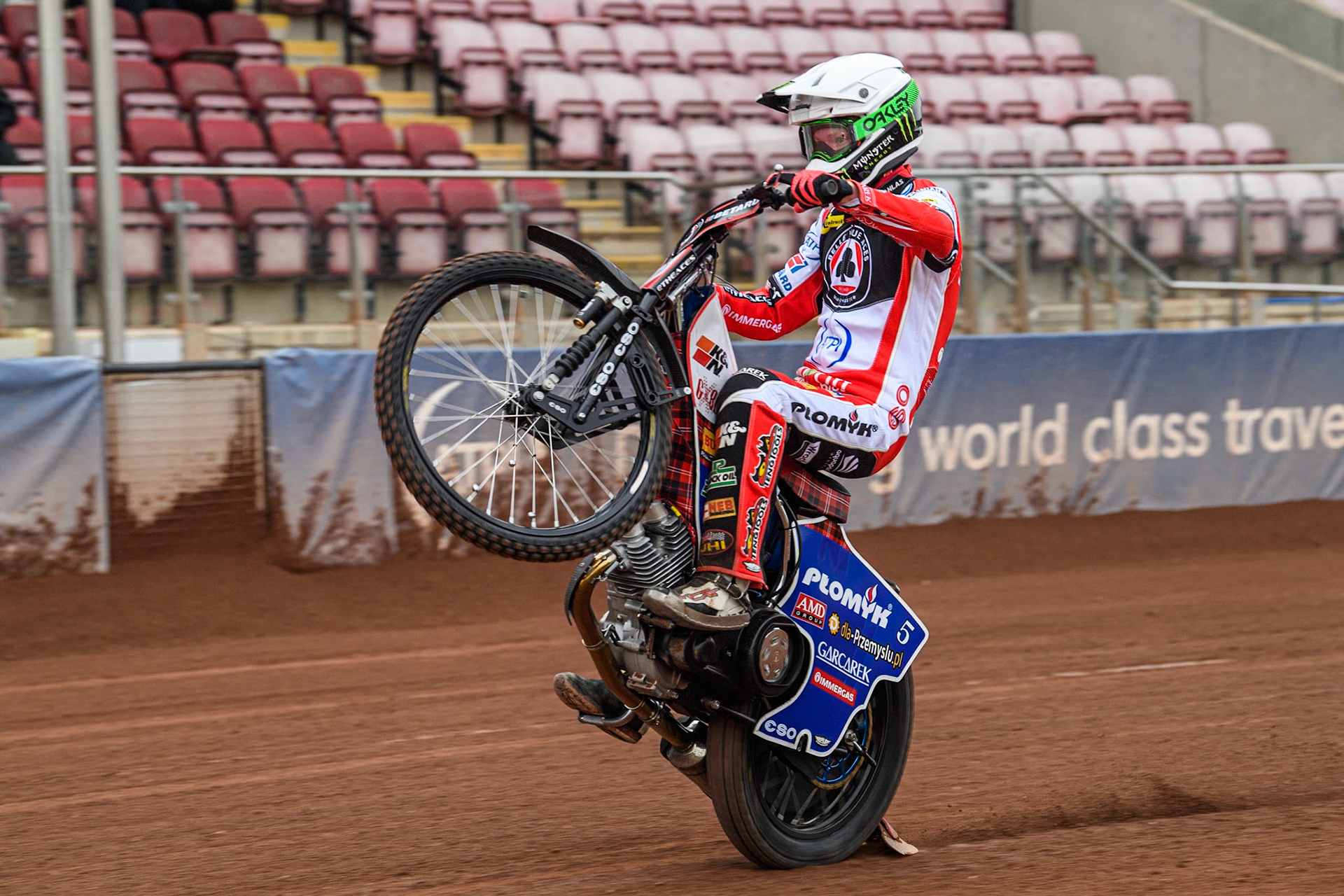 Belle Vue Aces' rider Dan Bewley pulls a wheelie during the Belle Vue Aces Media Day at the National Speedway Stadium, Manchester on Monday 11th March 2024. (Photo: Ian Charles | MI News)