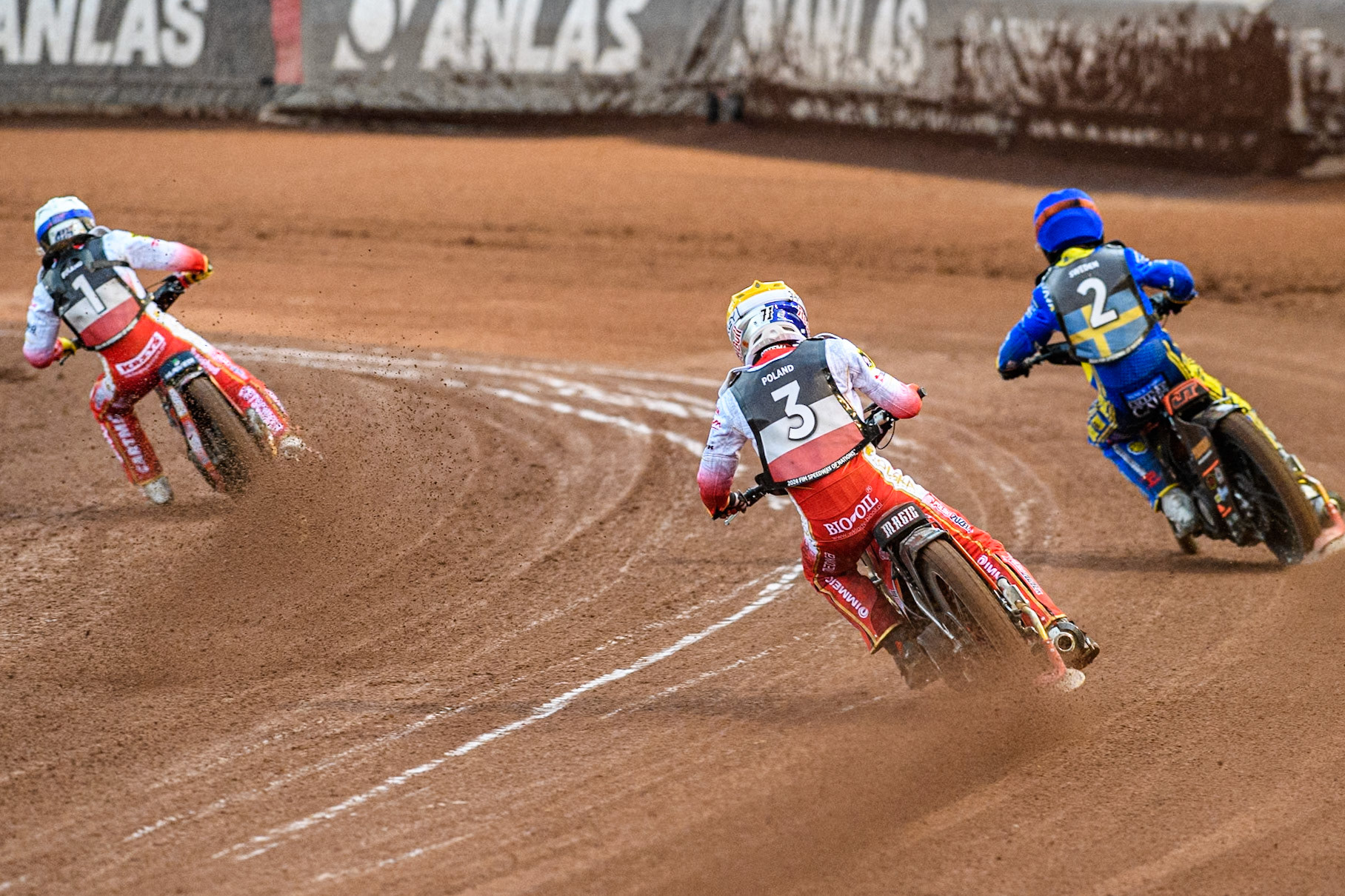 Maciej Janowski of Poland in Yellow chases Jacob Thorssell of Sweden in Blue and Dominik Kubera of Poland in White during the Monster Energy FIM Speedway of Nations Semi-Final 1 at the National Speedway Stadium, Manchester on Tuesday 9th July 2024. (Photo: Ian Charles | MI News)
