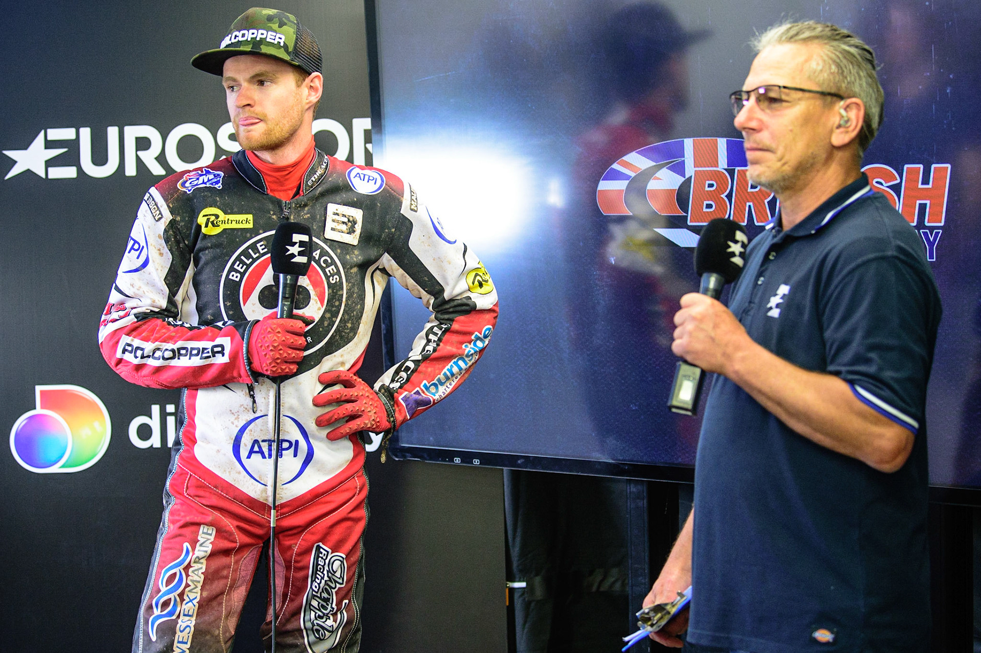 MANCHESTER UK  Brady Kurtz  (left) is interviewed by Eurosport presenter Sam Ermolenko during the SGB Premiership match between Belle Vue Aces and King's Lynn Stars at the National Speedway Stadium, Manchester on Monday 11th July 2022. (Credit: Ian Charles | MI News)