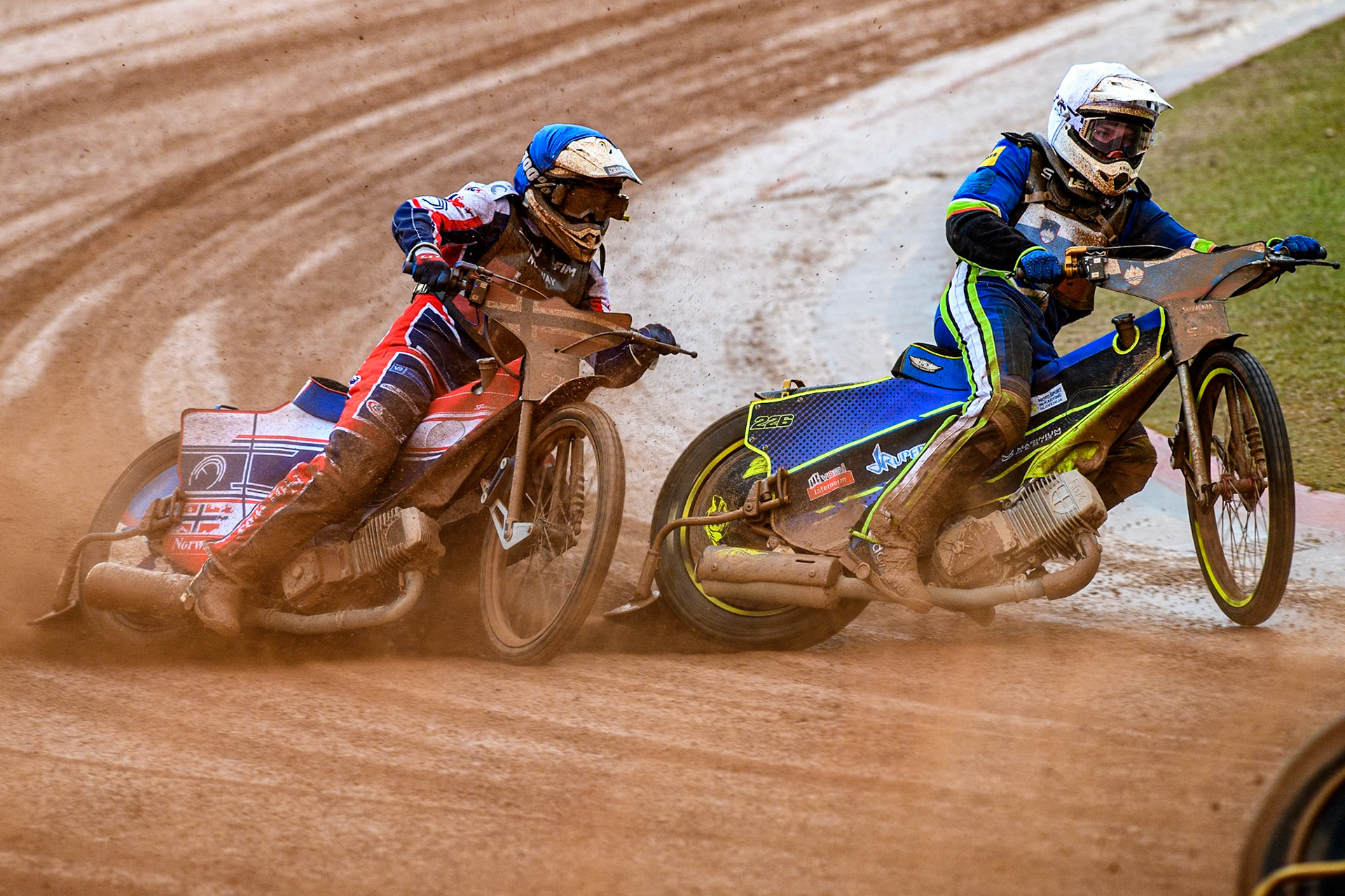 Truls Kamhaug of Norway in Blue chases Anze Grmek of Slovenia in White during the Monster Energy FIM Speedway of Nation Semi Final 2 at the National Speedway Stadium, Manchester on Wednesday 10th July 2024. (Photo: Ian Charles | MI News)