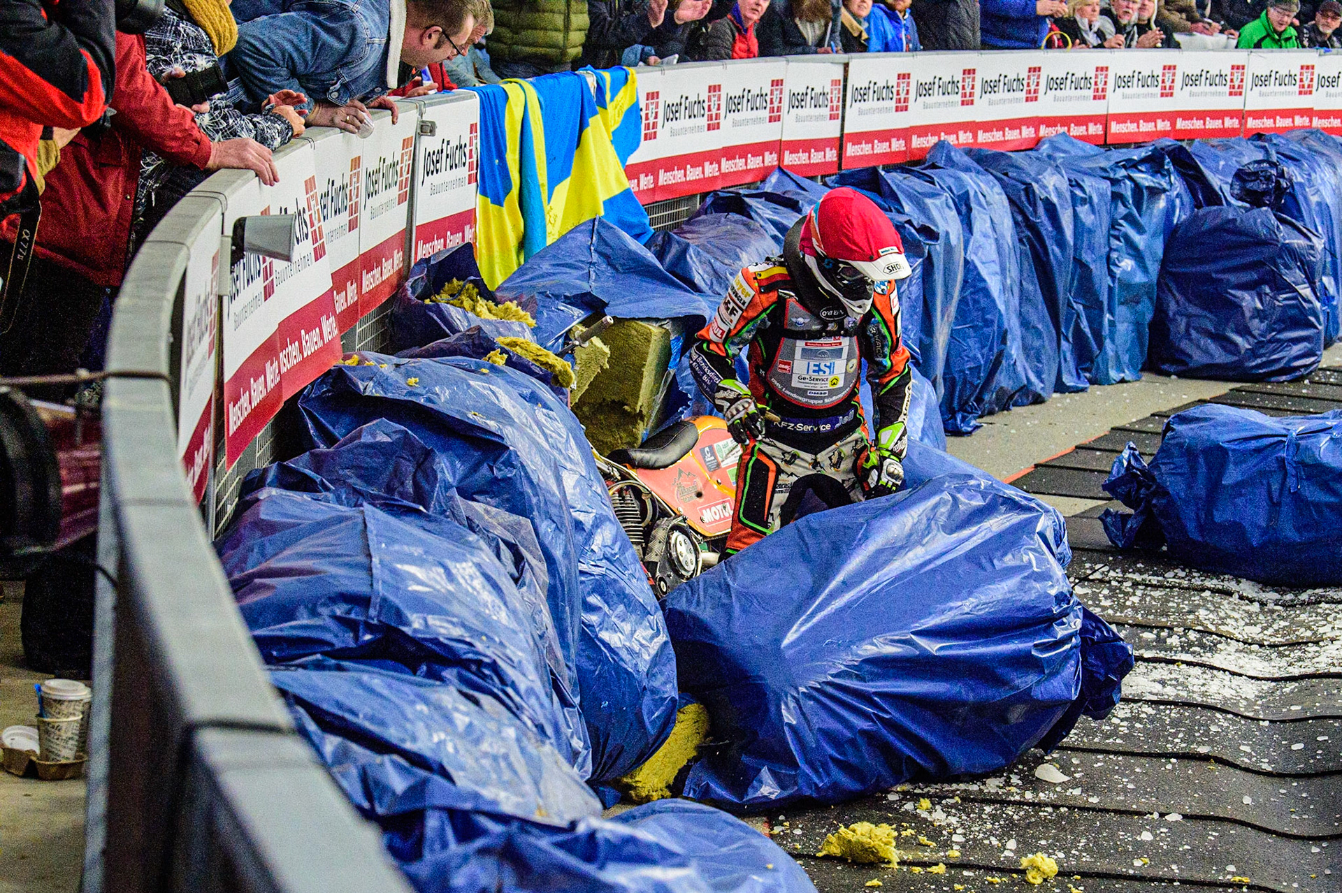 Markus Jell (82) sorts out his bike after crashing through the bales during the Ice Speedway Gladiators World Championship Final 2 at Max-Aicher-Arena, Inzell, Germany on Sunday 19th March 2023. (Photo: Ian Charles | MI News)