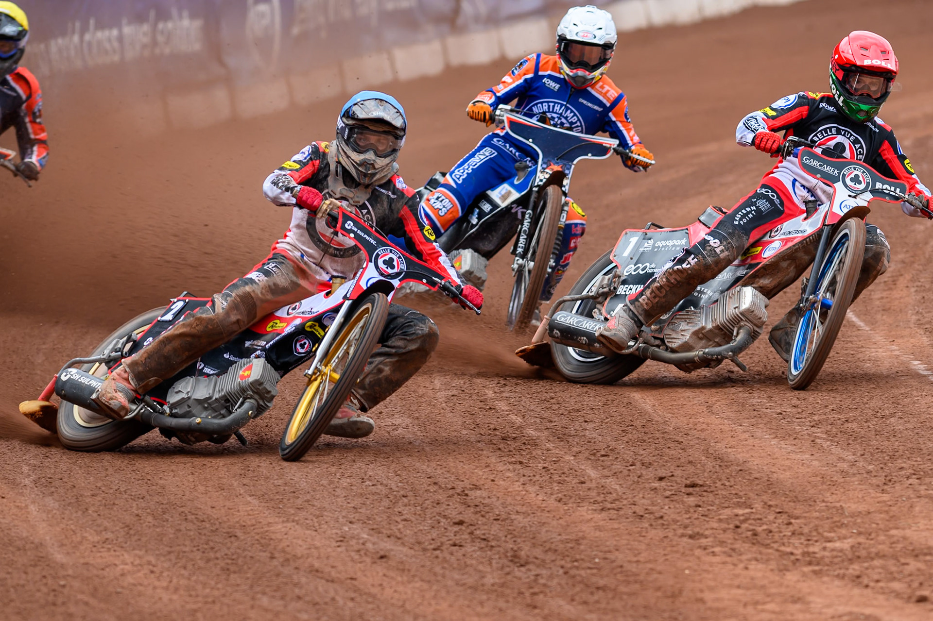 Norick Blödorn of Belle Vue Aces in Blue leading Brady Kurtz of Belle Vue Aces in Red and Nicolai Klindt of Northampton Foxes in White during the Rowe Motor Oil Premiership match between Belle Vue Aces and Northampton Foxes at the National Speedway Stadium, Manchester on Monday 4th May 2026. (Photo: Ian Charles | MI News)