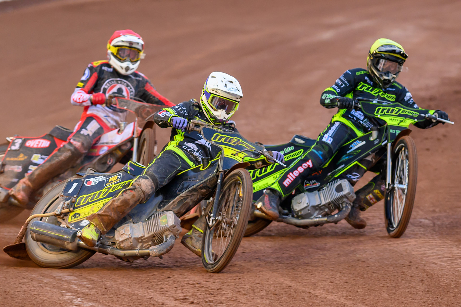 Tom Brennan of Ipswich Witches  in White rides outside Danny King of Ipswich Witches  in Yellow with Peter Kildemand of Belle Vue Aces  in Red behind during the Rowe Motor Oil Premiership match between Belle Vue Aces and Ipswich Witches at the National Speedway Stadium, Manchester on Monday 20th April 2026. (Photo: Ian Charles | MI News)