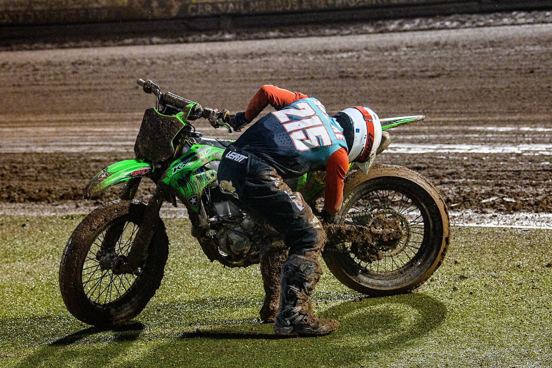 Ferran Sastre Martinez (215) from Spain checks his bike after his fall during the FIM World Flat Track Championship Round 1 at the National Speedway Stadium, Manchester on Saturday 5th August 2023. (Photo: Ian Charles | MI News)