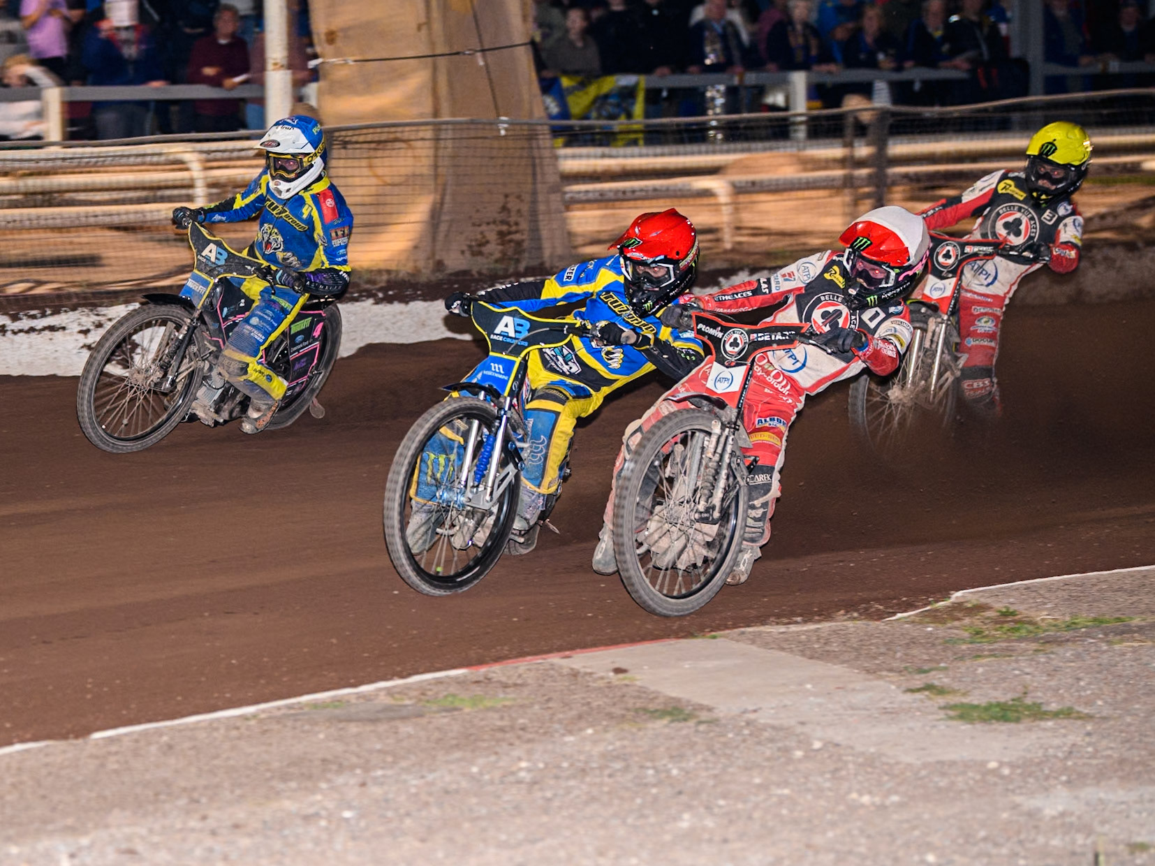 Belle Vue Aces' Dan Bewley   in White rides inside Sheffield Tigers' Jack Holder  in Red and Sheffield Tigers' Josh Pickering  in Blue with Belle Vue Aces' Jaimon Lidsey  in Yellow behind during the Rowe Motor Oil Premiership match between Sheffield Tigers and Belle Vue Aces at Owlerton Stadium, Sheffield on Monday 26th August 2024. (Photo: Ian Charles | MI News)