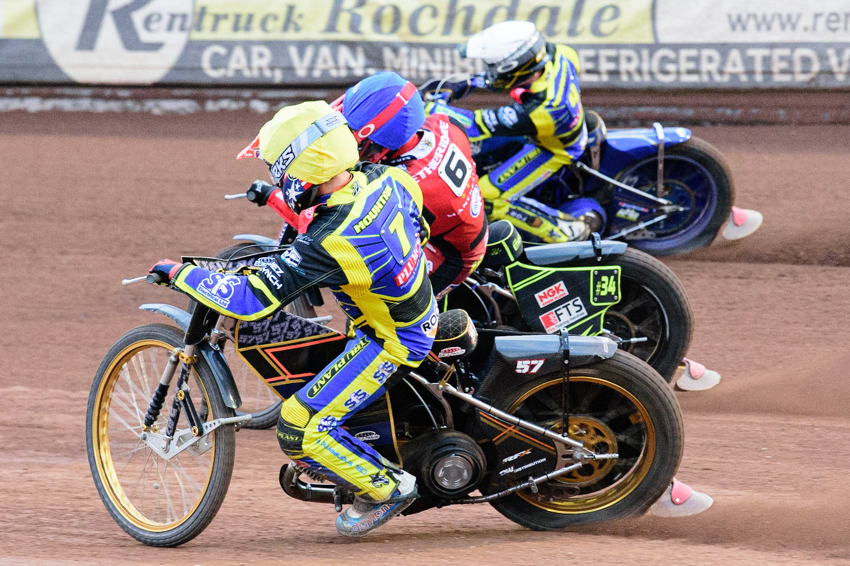 MANCHESTER, UK. JUL 5TH  Connor Mountain  (Yellow) inside Jye Etheridge  (Blue) and Kyle Howarth  (White)  during the SGB Premiership match between Belle Vue Aces and Sheffield Tigers at the National Speedway Stadium, Manchester on Tuesday 5th July 2022. (Credit: Ian Charles | MI News)