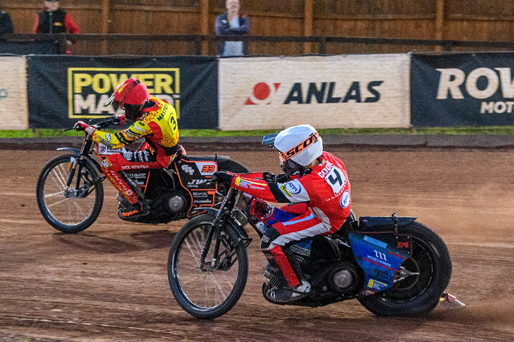 Belle Vue Aces' Ben Cook in White chases Leicester Lions' Sam Masters in Red during the Rowe Motor Oil Premiership match between Leicester Lions and Belle Vue Aces at the Pidcock Motorcycles Arena, Leicester on Thursday 25th July 2024. (Photo: Ian Charles | MI News)