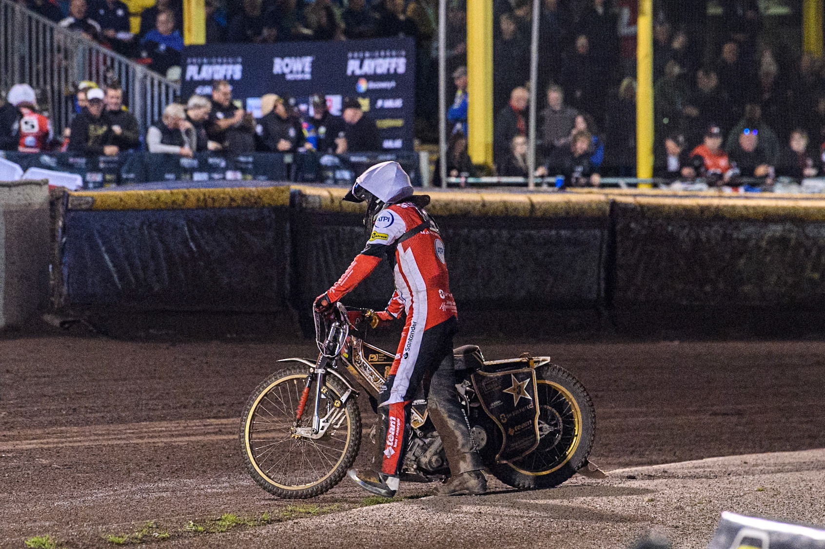 Belle Vue Aces' Norick Blodorn  pushes his bike from the track after his breakdown in heat 8 during the Rowe Motor Oil Premiership Play Off Semi Final 2nd leg between Sheffield Tigers and Belle Vue Aces at Owlerton Stadium, Sheffield on Thursday 19th September 2024. (Photo: Ian Charles | MI News)