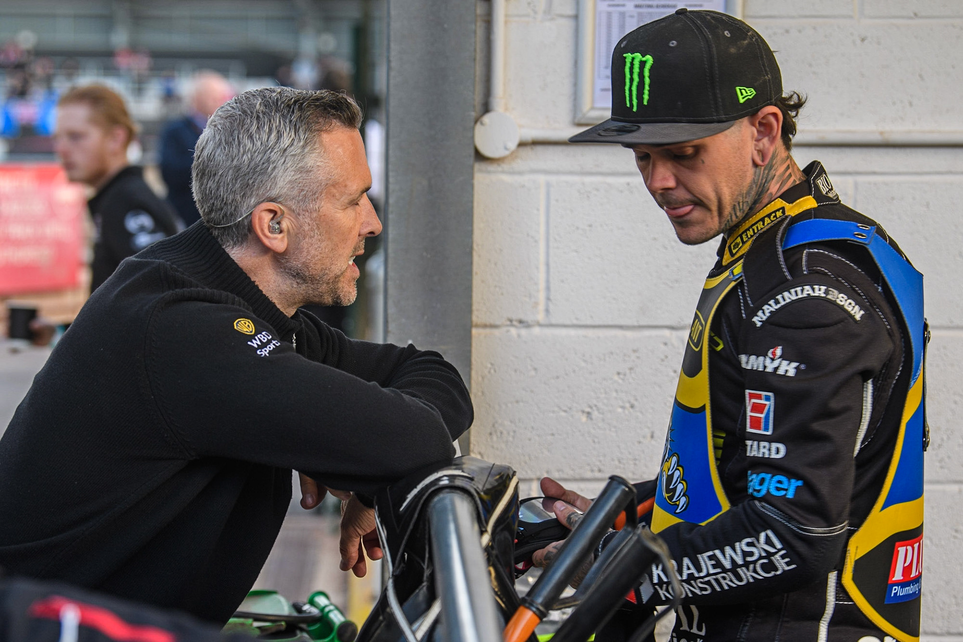 Eurosport presenter Scott Nicholls (left) chats with Tai Woffinden during the Sports Insure Premiership match between Belle Vue Aces and Sheffield Tigers at the National Speedway Stadium, Manchester on Monday 7th August 2023. (Photo: Ian Charles | MI News)