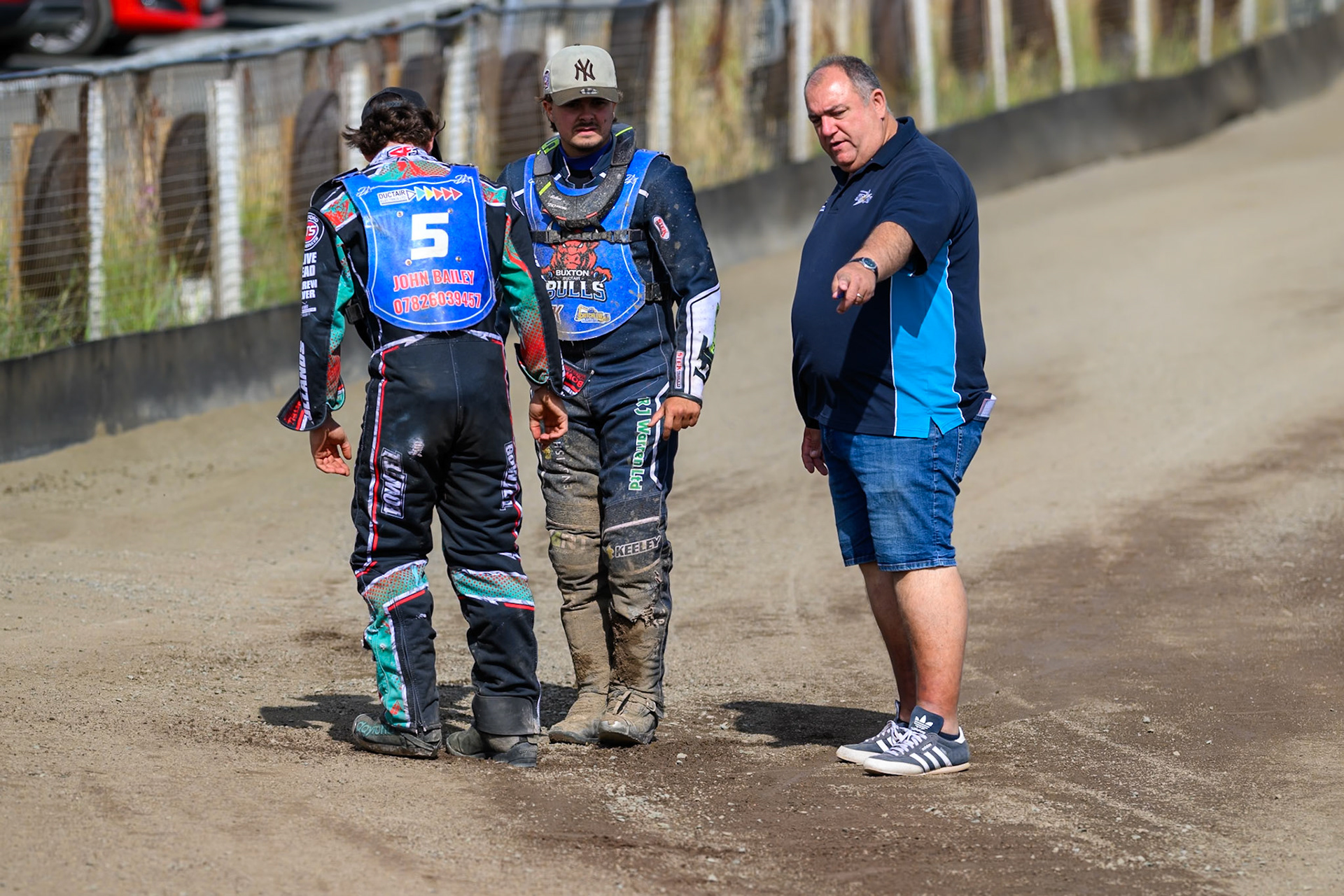 (L to R) Alfie Bowtell of Buxton Bulls, Nathan Ablitt, Guest Rider for Buxton Bulls  and Jason Pipe, Team Manager of Kings Lynn Young Stars discuss the condition of the track during the WSRA National Development League match between Buxton Bulls and King's Lynn Young Stars at Hi-Edge Speedway, Buxton on Sunday 9th August 2026. (Photo: Ian Charles | MI News)