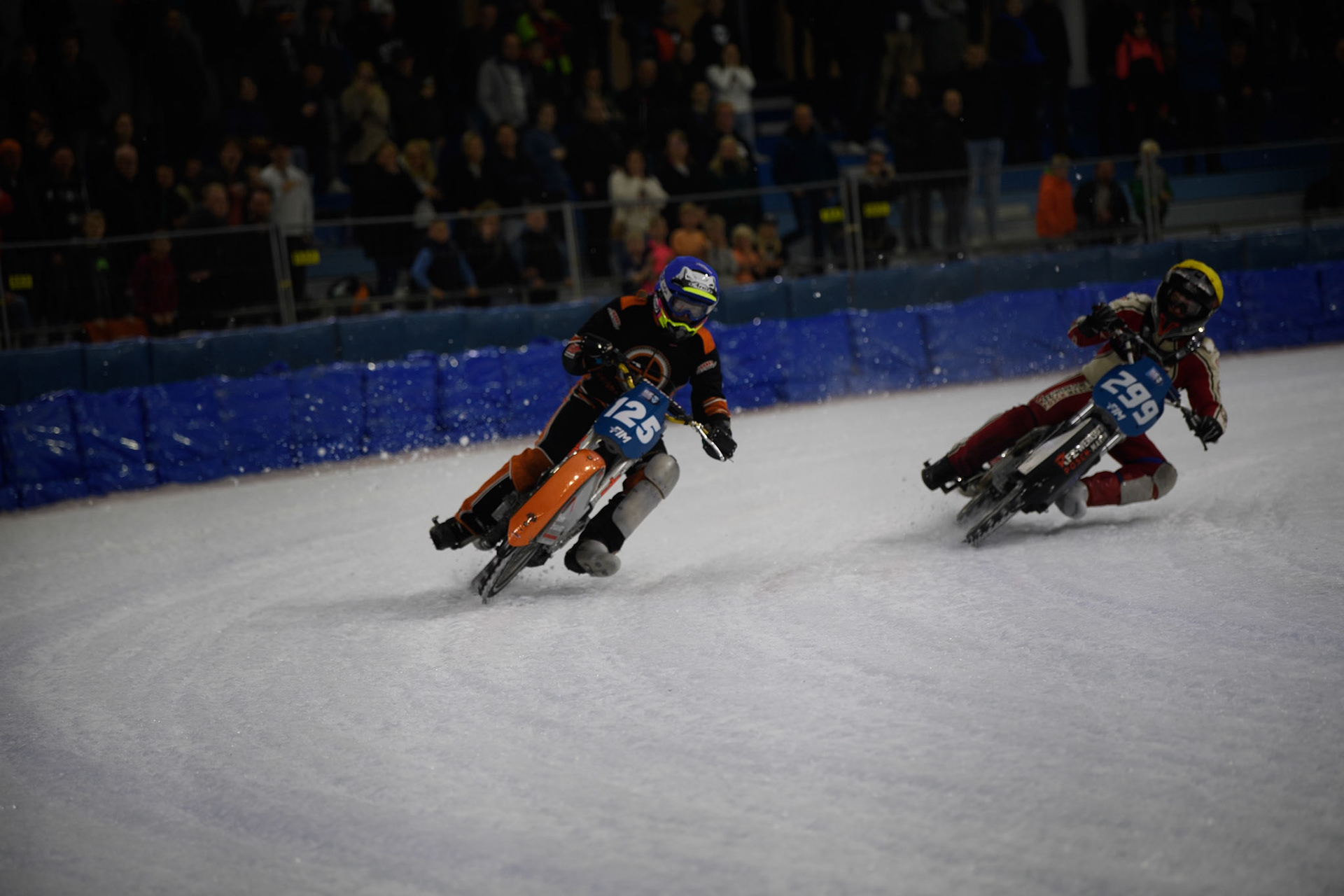 Sebastian Reitsma (125) of The Netherlands \in Blue rides outside Martin Posch (299) of Austria in Yellow during the FIM Ice Speedway Gladiators World Championship, Final 4 at the Ice Stadium, Thialf, Heerenveen on Sunday 6th April 2025. (Photo: Ian Charles | MI News)