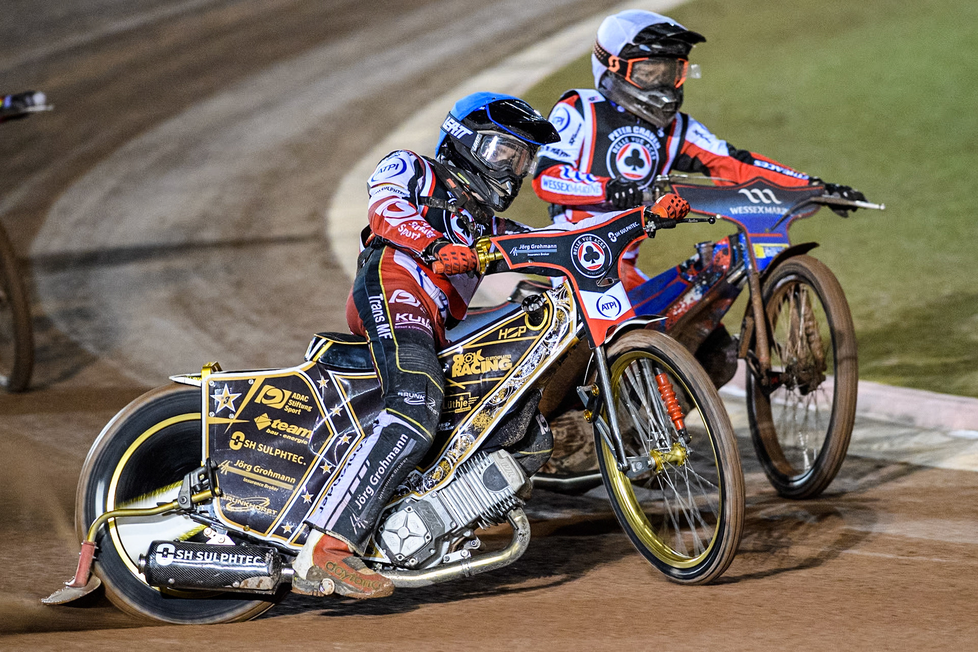 Germany's Norick Blödorn (Blue) outside Australia's Ben Cook (White) during the Peter Craven Memorial Trophy meeting at the National Speedway Stadium, Manchester on Monday 18th March 2024. (Photo: Ian Charles | MI News)