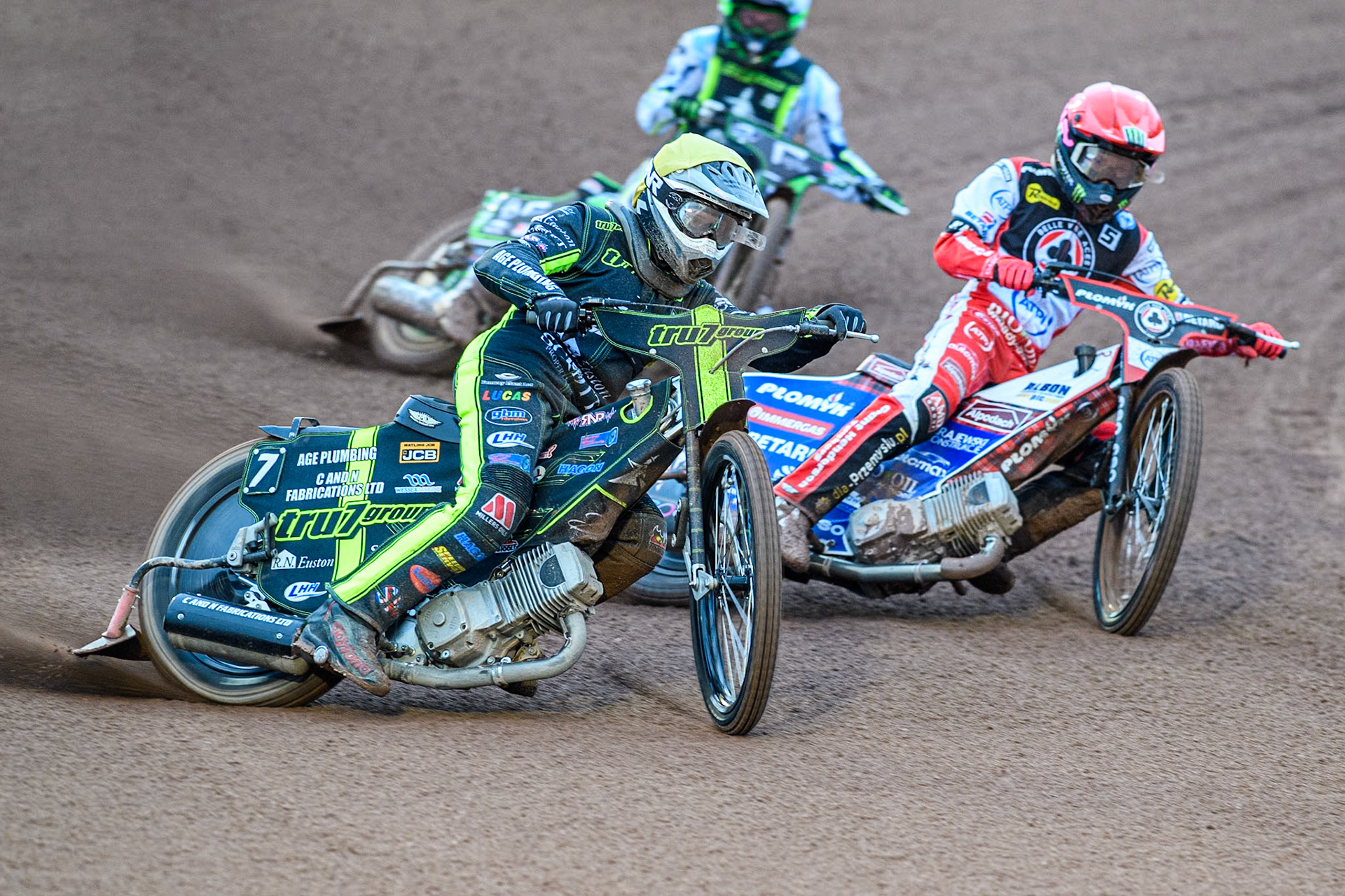 Ipswich Witches' Dan Thompson in Yellow rides outside Belle Vue Aces' Dan Bewley in Red with Ipswich Witches' Guest Charles Wright in White behind during the Rowe Motor Oil Premiership match between Belle Vue Aces and Ipswich Witches at the National Speedway Stadium, Manchester on Monday 22nd April 2024. (Photo: Ian Charles | MI News)