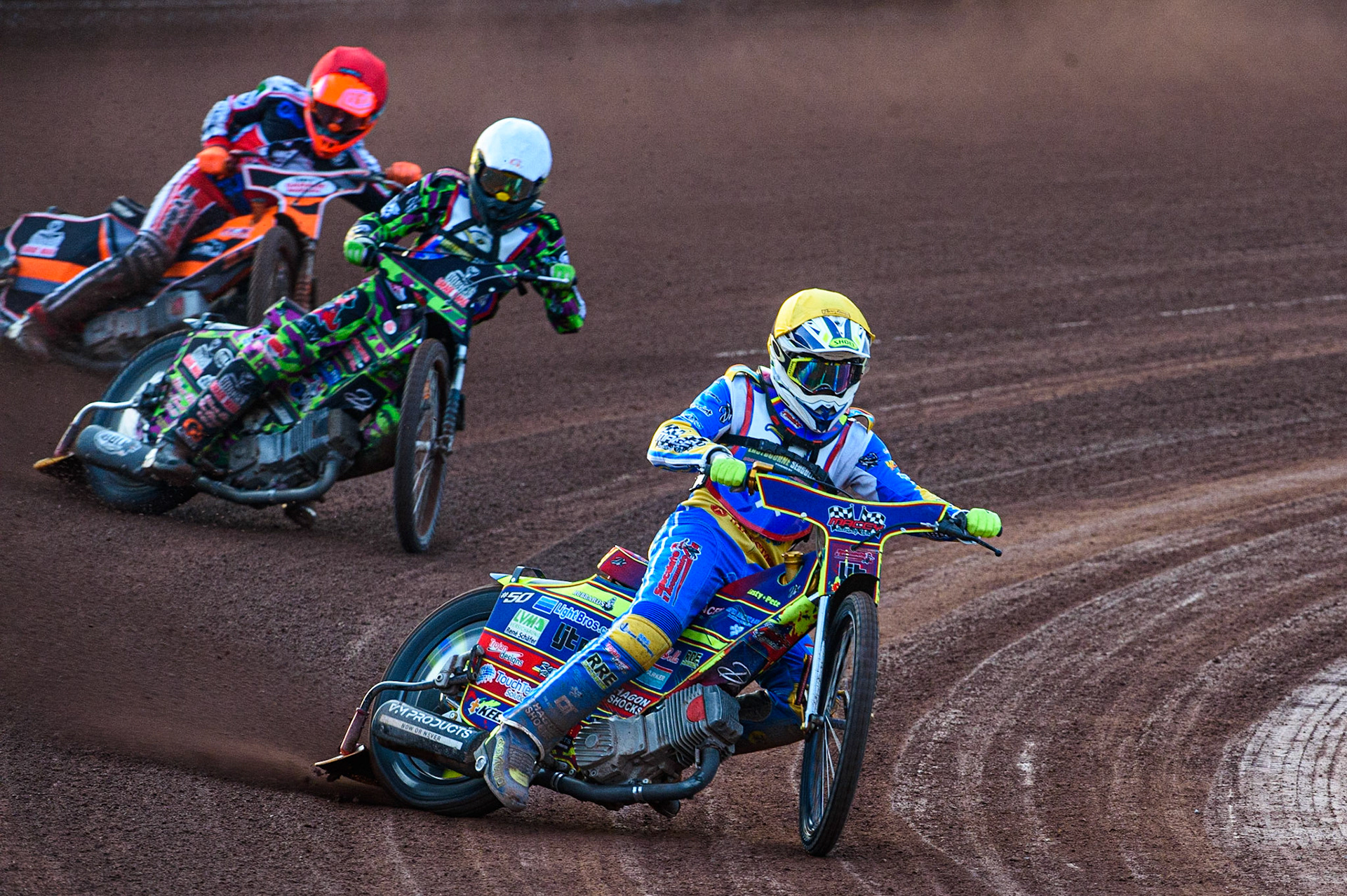 MANCHESTER, UK. JULY 23RD  Nathan Ablitt (Yellow) leads team mate Richard Andrews  (White) and Connor Coles  (Red) during the National Development League match between Belle Vue Colts and Eastbourne Seagulls at the National Speedway Stadium, Manchester on Friday 23rd July 2021. (Credit: Ian Charles | MI News)